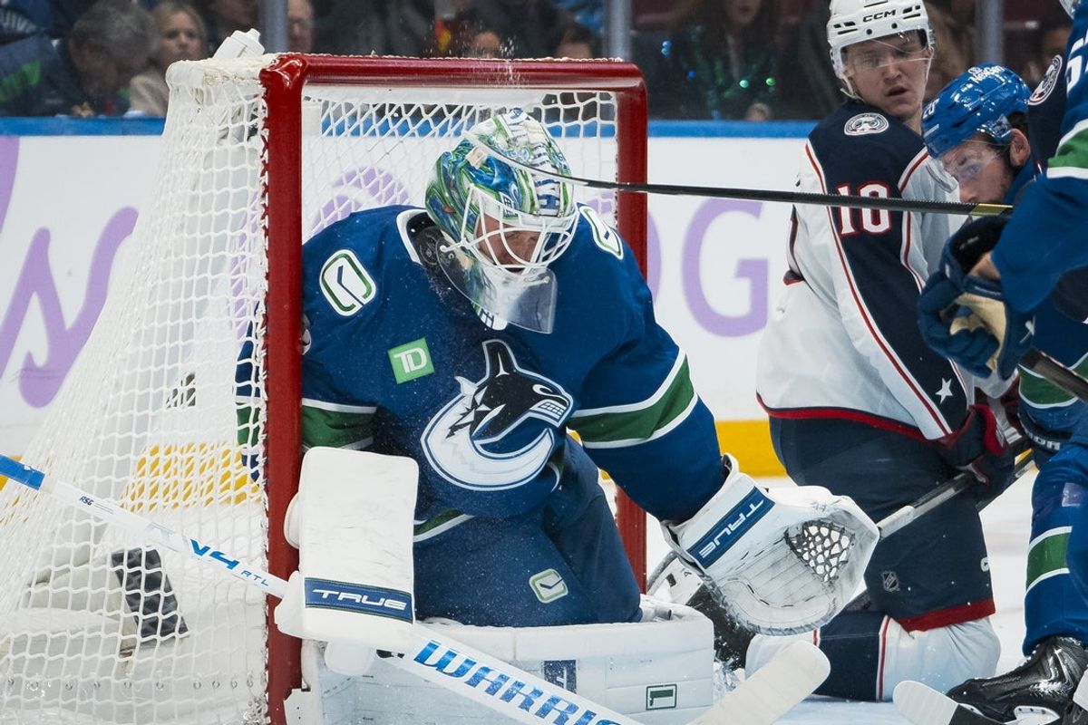 Nov 8, 2025; Vancouver, British Columbia, CAN; Vancouver Canucks goalie Kevin Lankinen (32) makes a save against the Columbus Blue Jackets in the first period at Rogers Arena. Mandatory Credit: Bob Frid-Imagn Images