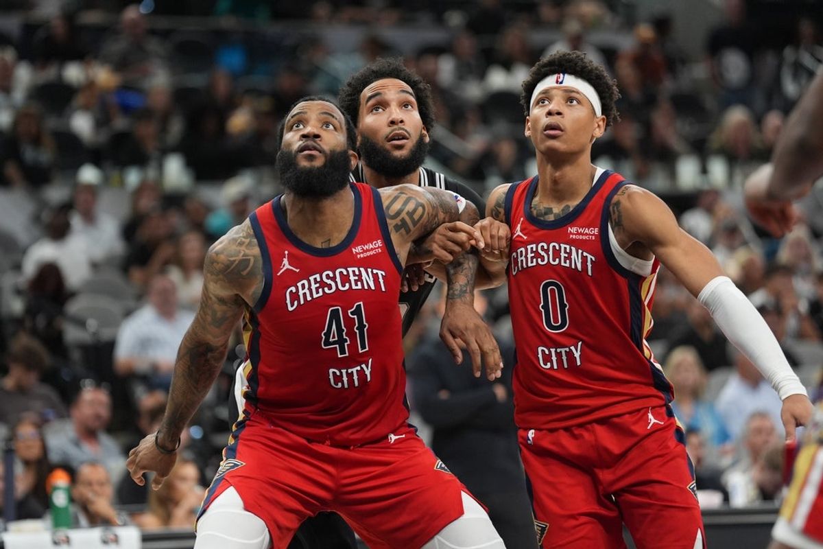 Nov 8, 2025; San Antonio, Texas, USA;  New Orleans Pelicans guards Saddiq Bey (41) and Jeremiah Fears (0) block out San Antonio Spurs forward Julian Champagnie (30) in the second half at Frost Bank Center. Mandatory Credit: Daniel Dunn-Imagn Images