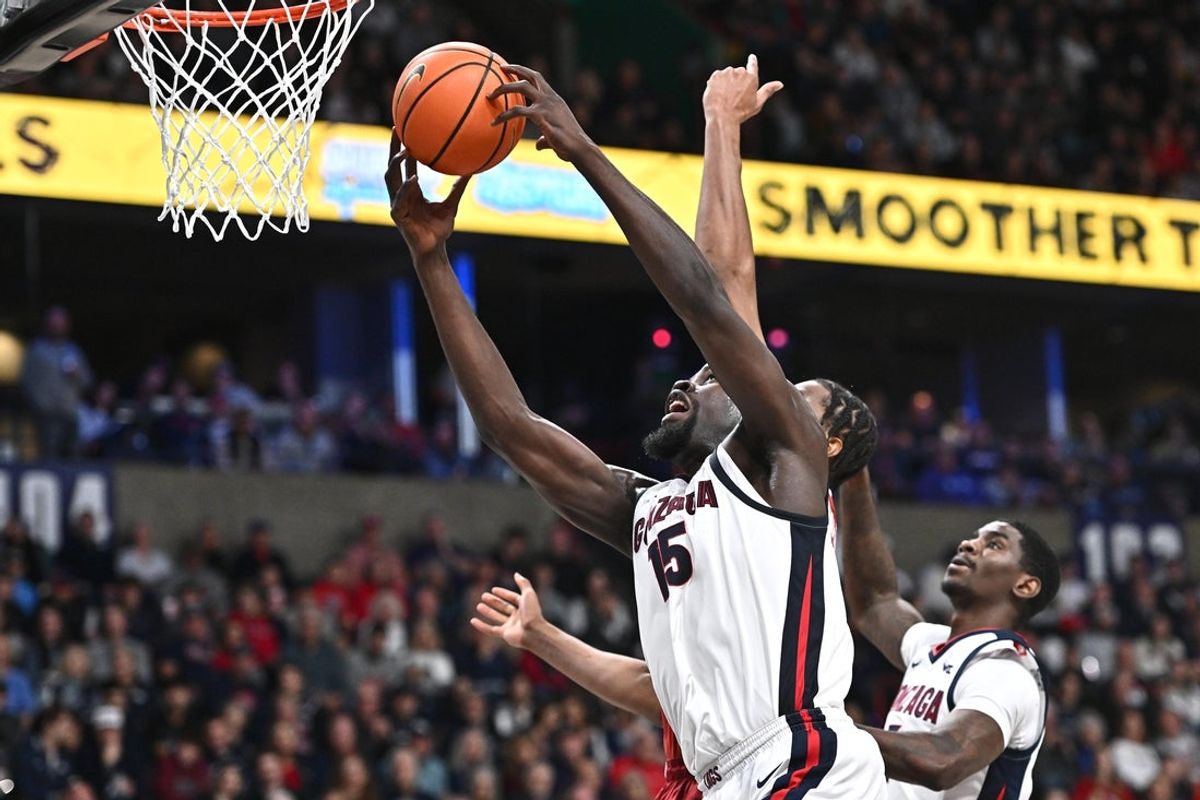 Nov 8, 2025; Spokane, Washington, USA; Gonzaga Bulldogs forward Graham Ike (15) rebounds the ball against Oklahoma Sooners forward Mohamed Wague (5) in the first half at Numerica Veterans Arena. Mandatory Credit: James Snook-Imagn Images