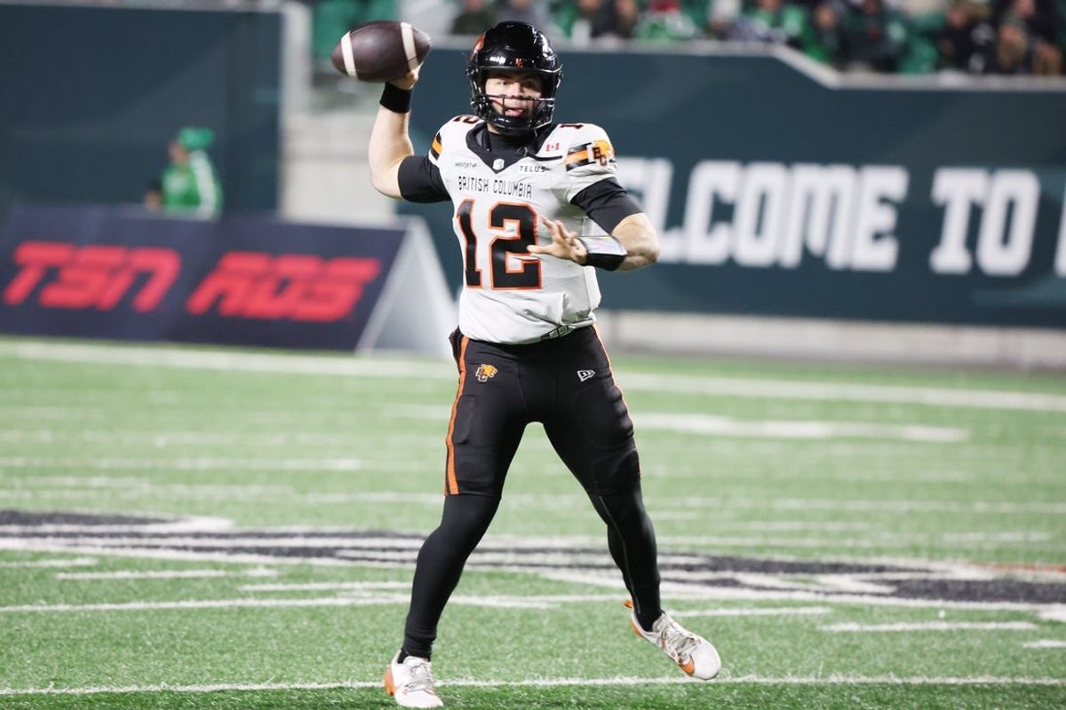 Nov 8, 2025; Regina, Saskatchewan, Canada;  BC Lions quarterback Nathan Rourke (12) looks for a receiver downfield during the second half of the CFL Western Conference Final between the BC Lions and the Saskatchewan Roughriders at Mosaic Stadium. Mandatory Credit: Bruce Fedyck-Imagn Images