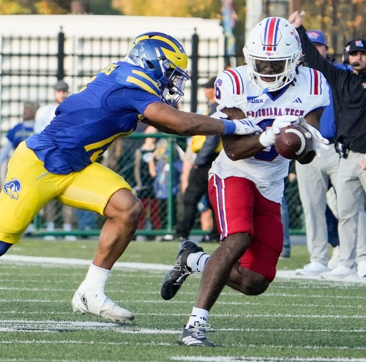 Delaware receiver Kyre Duplessis (left) tackles Louisiana Tech’s Jakari Foster after Foster made an interception In the first quarter at Delaware Stadium, Nov. 8, 2025.