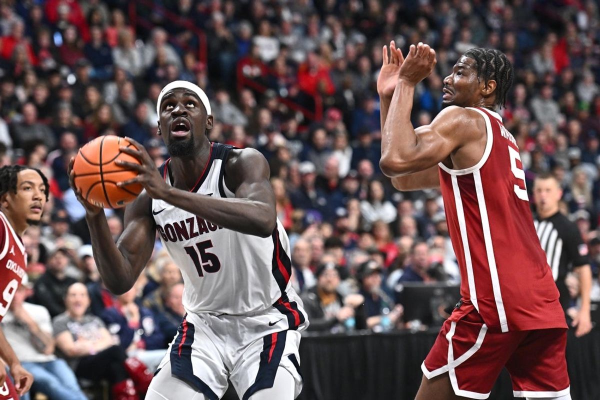 Nov 8, 2025; Spokane, Washington, USA; Gonzaga Bulldogs forward Graham Ike (15) shoots the ball against Oklahoma Sooners forward Mohamed Wague (5) in the second half at Numerica Veterans Arena. Gonzaga Bulldogs won 83-68. Mandatory Credit: James Snook-Imagn Images