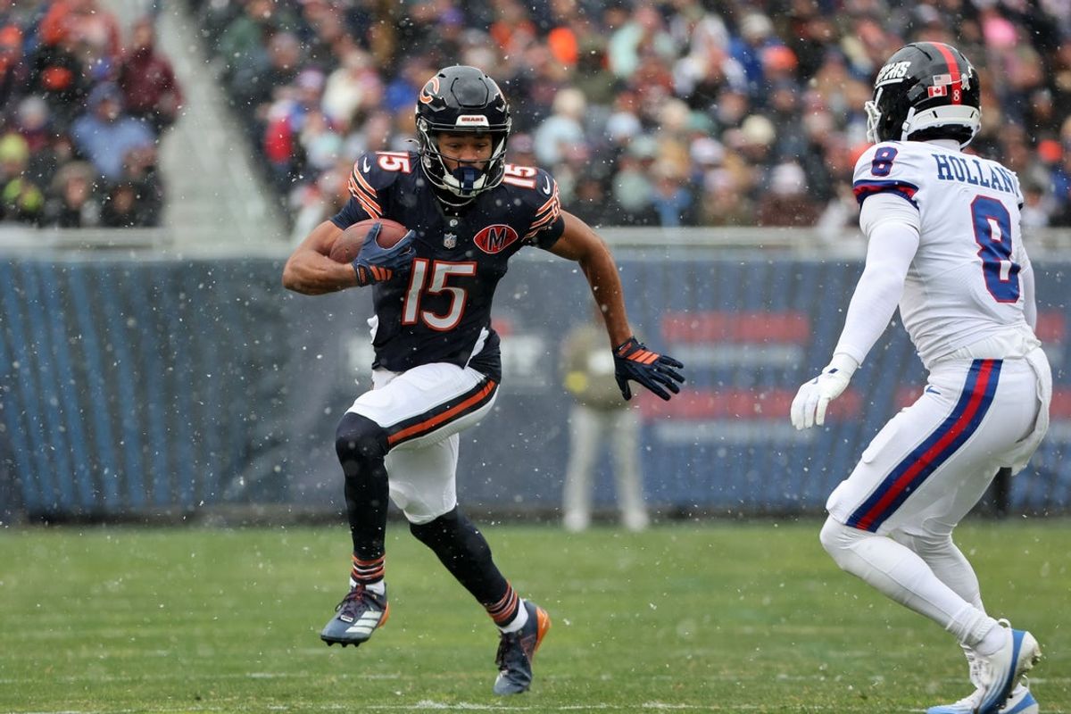 Nov 9, 2025; Chicago, Illinois, USA; Chicago Bears wide receiver Rome Odunze (15) makes a catch against New York Giants safety Jevon Holland (8) during the first half at Soldier Field. Mandatory Credit: Mike Dinovo-Imagn Images