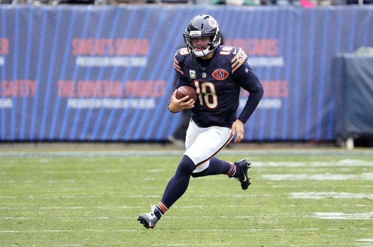 Nov 9, 2025; Chicago, Illinois, USA; Chicago Bears quarterback Caleb Williams (18) scrambles during the first half against the New York Giants at Soldier Field. Mandatory Credit: David Banks-Imagn Images