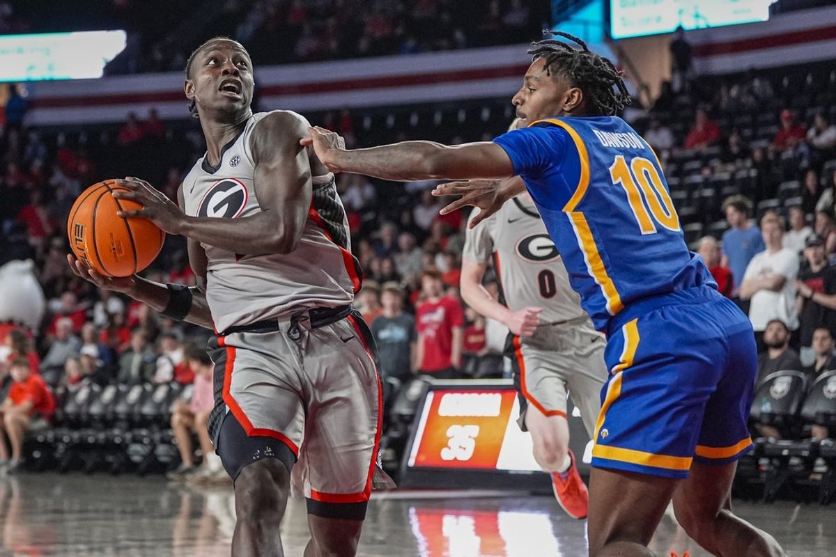 Nov 9, 2025; Athens, Georgia, USA; Georgia Bulldogs guard Justin Bailey (7) drives to the basket against Morehead State Eagles guard Chase Dawson (10) during the first half at Stegeman Coliseum. Mandatory Credit: Dale Zanine-Imagn Images
