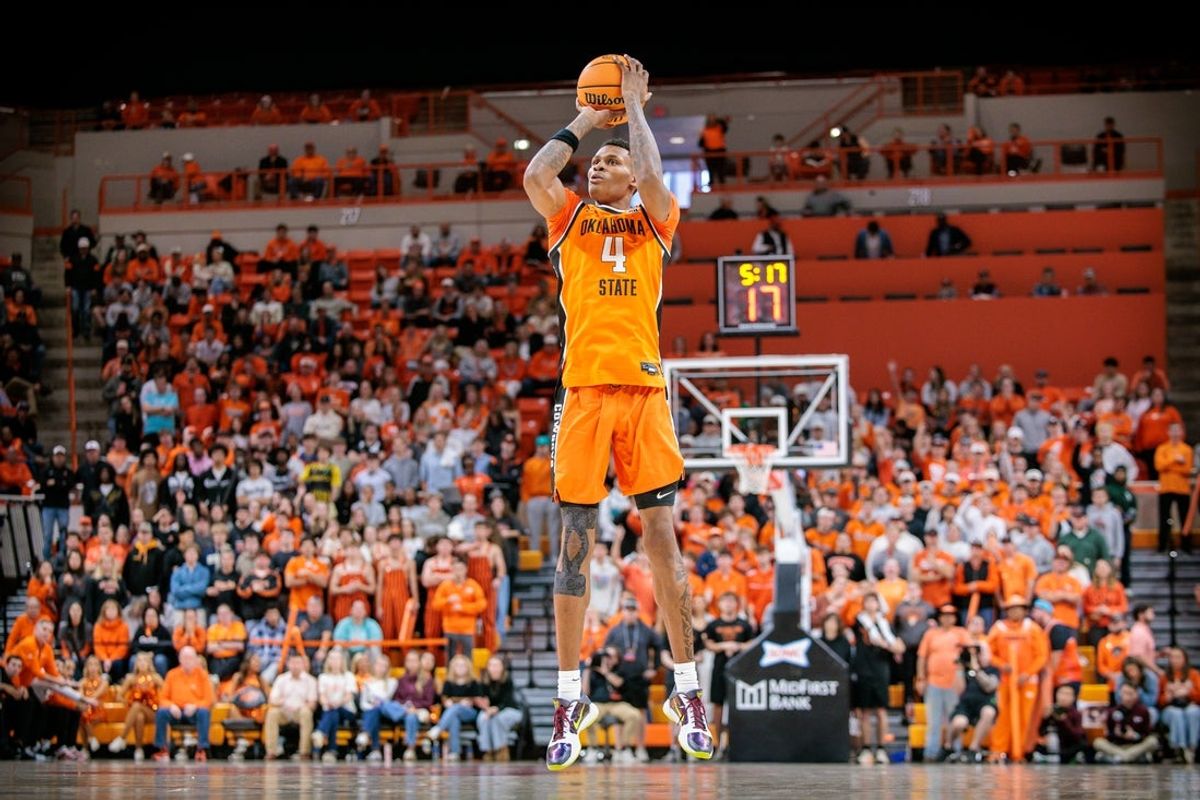 Nov 9, 2025; Stillwater, Oklahoma, USA; Oklahoma State Cowboys forward Christian Coleman (4) shoots the ball during the first half against the Texas A&M Aggies at Gallagher-Iba Arena. Mandatory Credit: William Purnell-Imagn Images