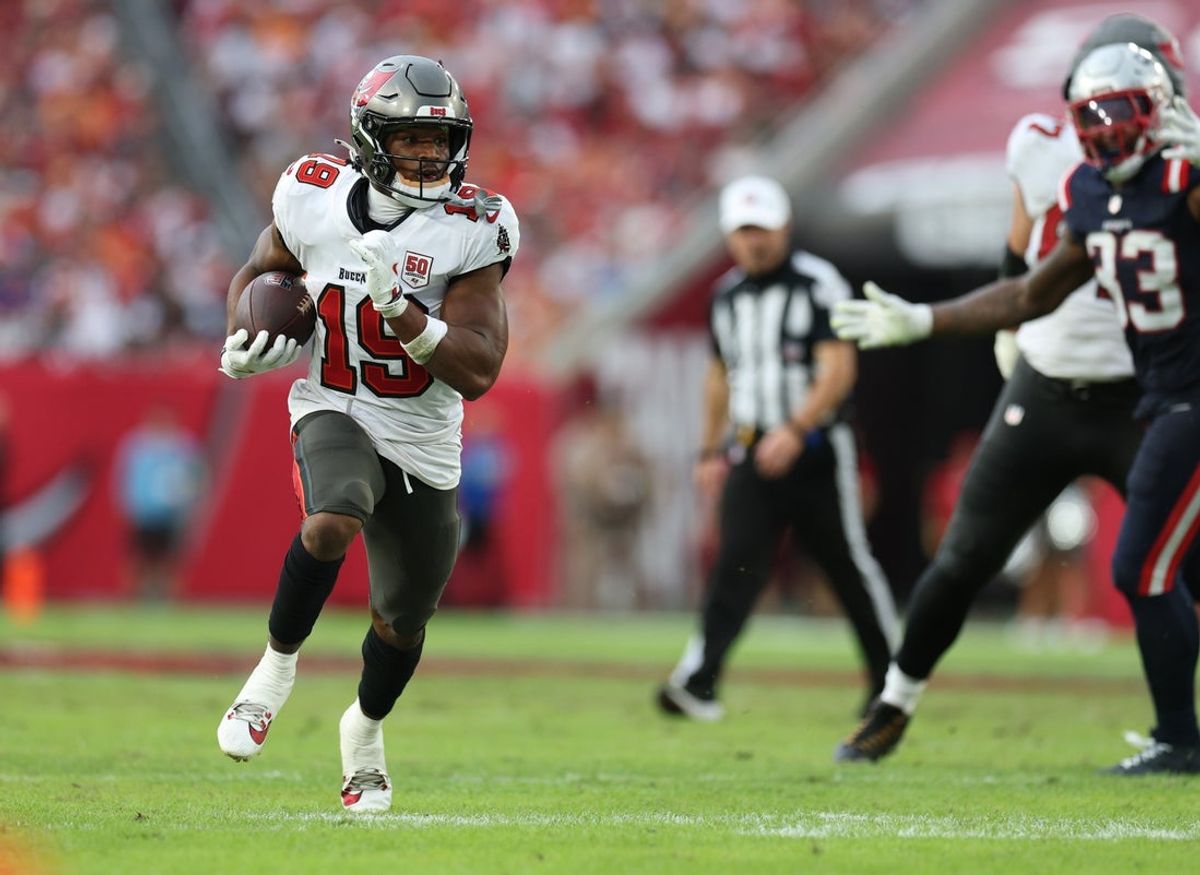 Nov 9, 2025; Tampa, Florida, USA; Tampa Bay Buccaneers running back Josh Williams (18) runs for a gain during the third quarter against the New England Patriots at Raymond James Stadium. Mandatory Credit: Nathan Ray Seebeck-Imagn Images