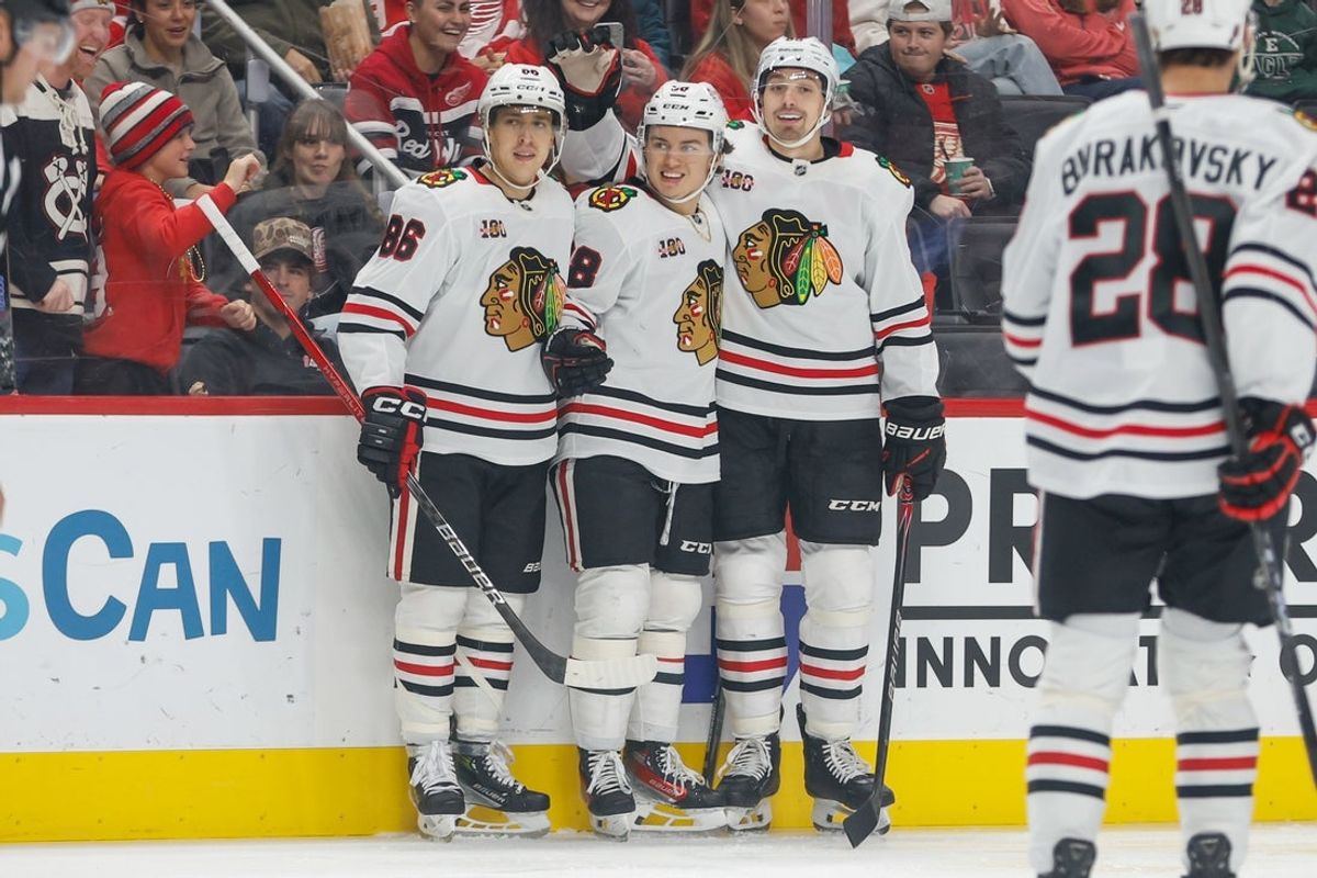 Nov 9, 2025; Detroit, Michigan, USA; Chicago Blackhawks center Connor Bedard (98) celebrates with defenseman Artyom Levshunov (55) and center Teuvo Teravainen (86) after scoring a goal in the first period at Little Caesars Arena. Mandatory Credit: Brian Bradshaw Sevald-Imagn Images