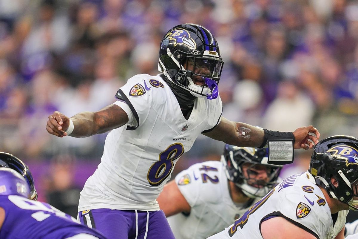 Nov 9, 2025; Minneapolis, Minnesota, USA; Baltimore Ravens quarterback Lamar Jackson (8) under center against the Minnesota Vikings in the fourth quarter at U.S. Bank Stadium. Mandatory Credit: Brad Rempel-Imagn Images