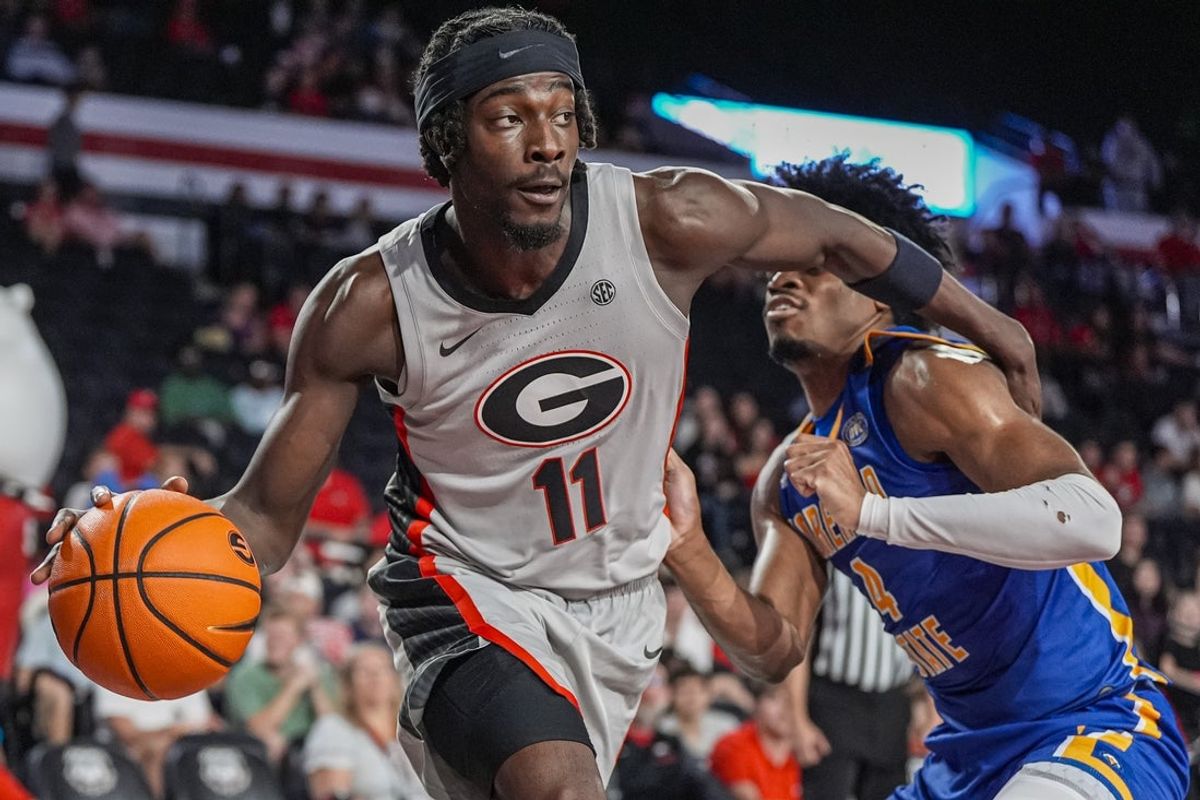 Nov 9, 2025; Athens, Georgia, USA; Georgia Bulldogs forward Dylan James (11) dribbles past Morehead State Eagles forward Jon Carroll (4) at Stegeman Coliseum. Mandatory Credit: Dale Zanine-Imagn Images