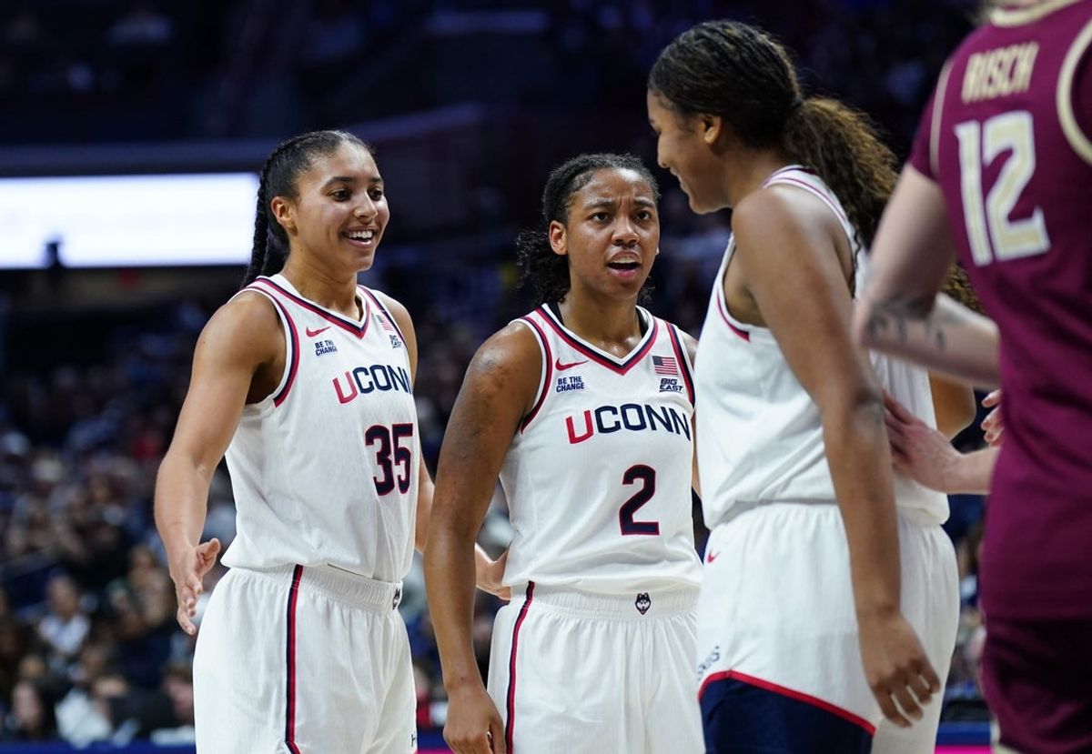 Nov 9, 2025; Storrs, Connecticut, USA; UConn Huskies guard Azzi Fudd (35) and guard Kk Arnold (2) react with forward Sarah Strong (21) after a play against the Florida State Seminoles in the first half at Harry A. Gampel Pavilion. Mandatory Credit: David Butler II-Imagn Images