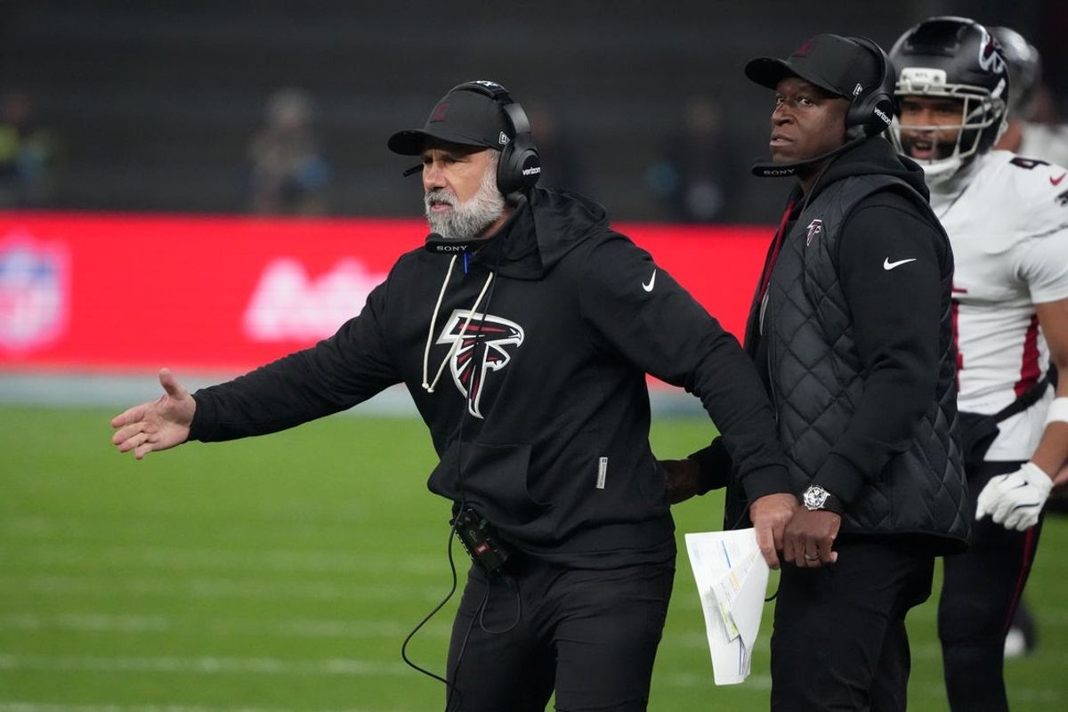Nov 9, 2025; Berlin, Germany; Atlanta Falcons defensive coordinator Jeff Ulbrich (left) and head coach Raheem Morris in the second half against the Atlanta Falcons during the NFL Berlin Game at Olympic Stadium. Mandatory Credit: Kirby Lee-Imagn Images