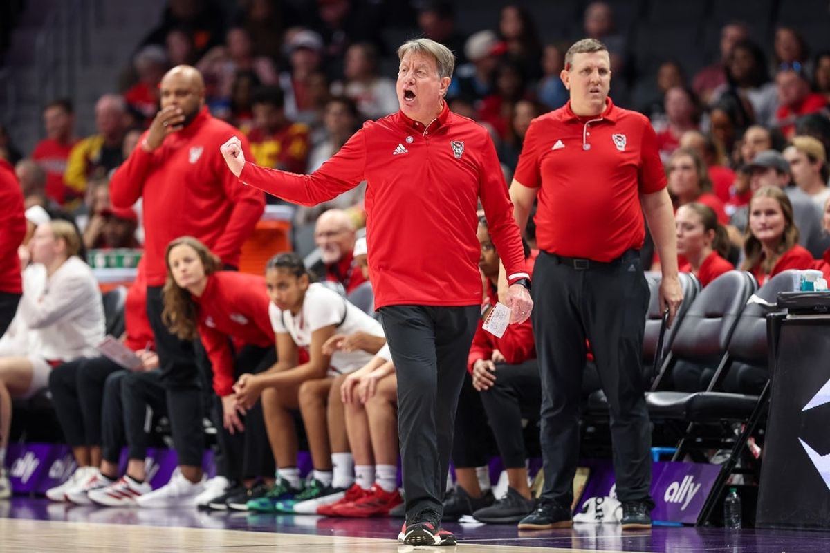 Nov 9, 2025; Charlotte, North Carolina, USA; NC State Wolfpack head coach Wes Moore in action against the Southern California Trojans during the fourth quarter of the Ally Tipoff game at Spectrum Center. Mandatory Credit: Cory Knowlton-Imagn Images