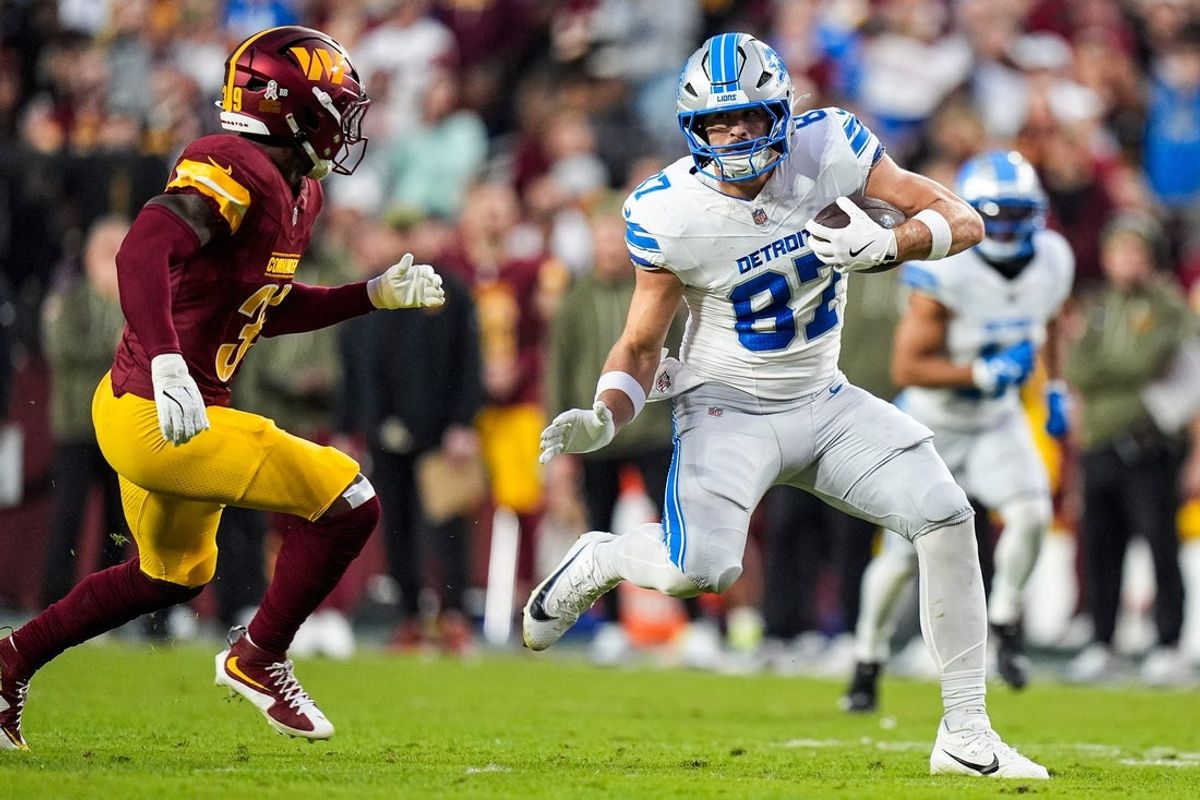 Detroit Lions tight end Sam LaPorta (87) makes a catch against Washington Commanders safety Jeremy Reaves (39) during the first half at Northwest Stadium in Landover, Md. on Sunday, November 9, 2025.