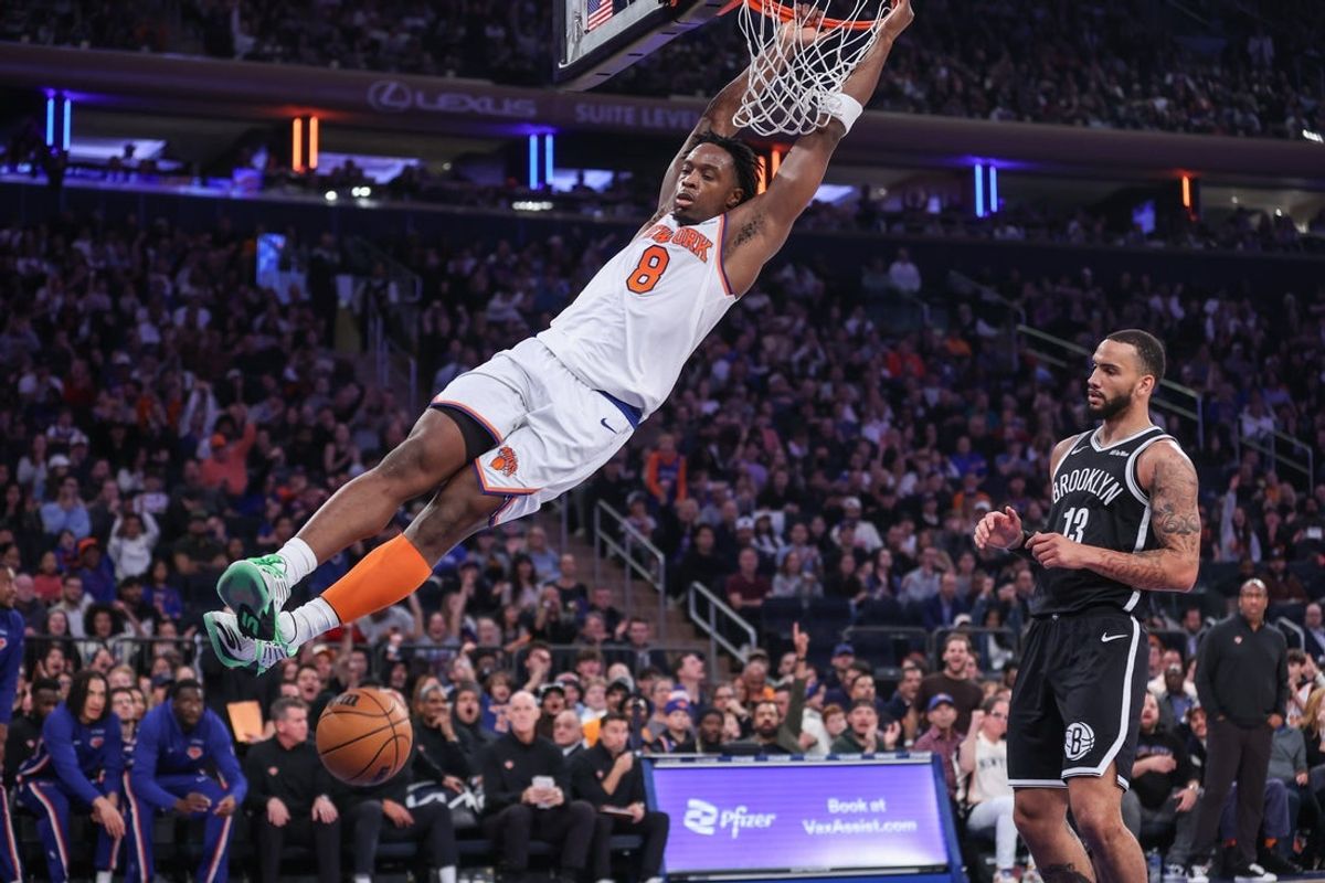 Nov 9, 2025; New York, New York, USA;  New York Knicks forward OG Anunoby (8) dunks past Brooklyn Nets guard Tyrese Martin (13) in the first quarter at Madison Square Garden. Mandatory Credit: Wendell Cruz-Imagn Images