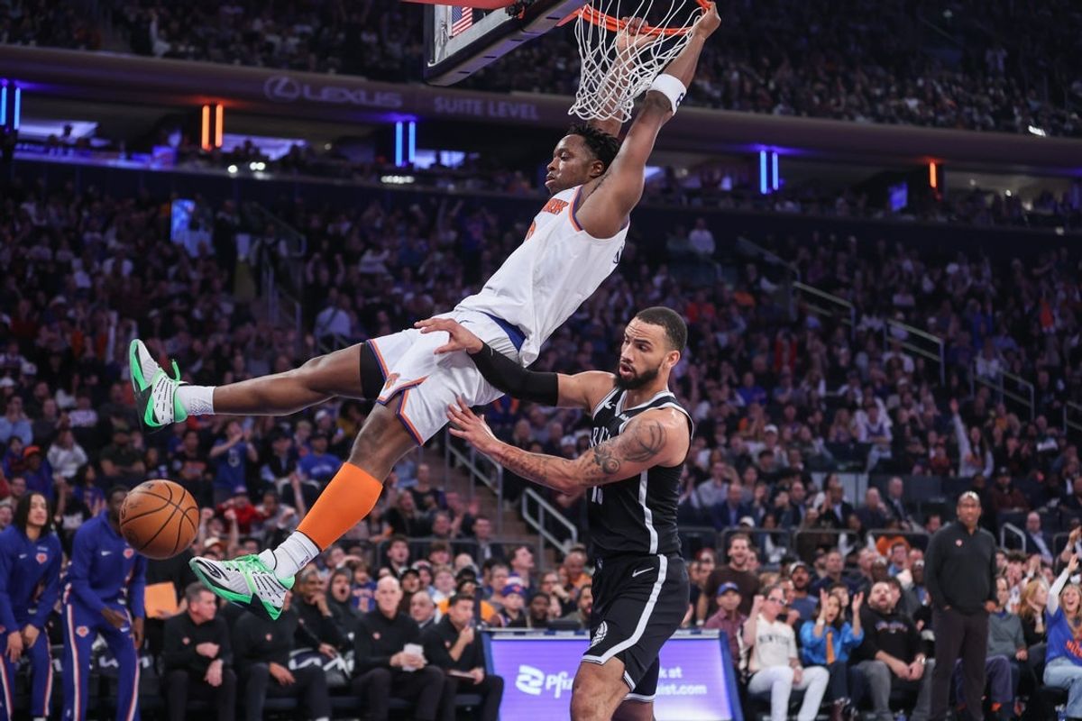 Nov 9, 2025; New York, New York, USA;  New York Knicks forward OG Anunoby (8) dunks past Brooklyn Nets guard Tyrese Martin (13) in the first quarter at Madison Square Garden. Mandatory Credit: Wendell Cruz-Imagn Images