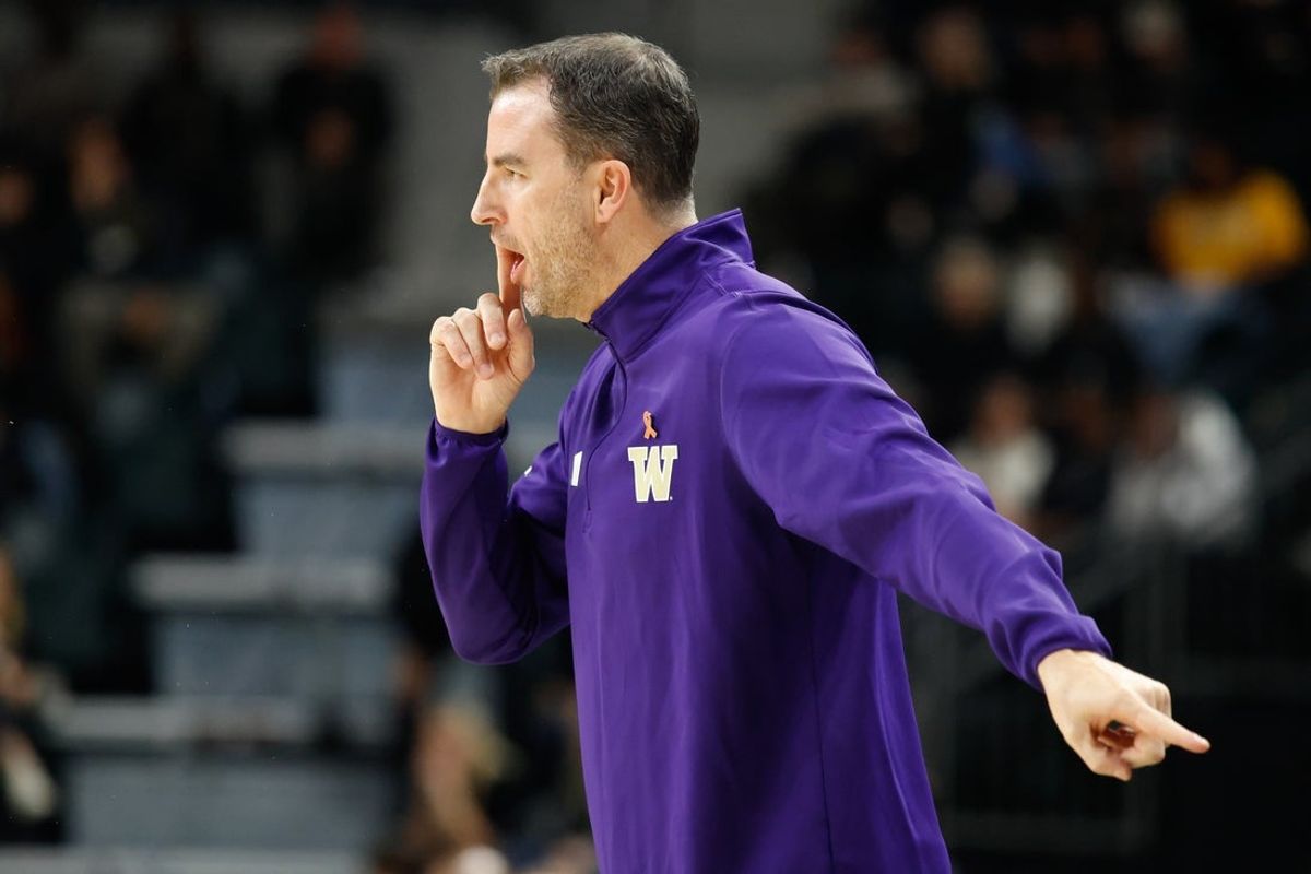 Nov 9, 2025; Waco, Texas, USA;  Washington Huskies head coach Danny Sprinkle calls a play against the Baylor Bears during the first half at Paul and Alejandra Foster Pavilion. Mandatory Credit: Chris Jones-Imagn Images