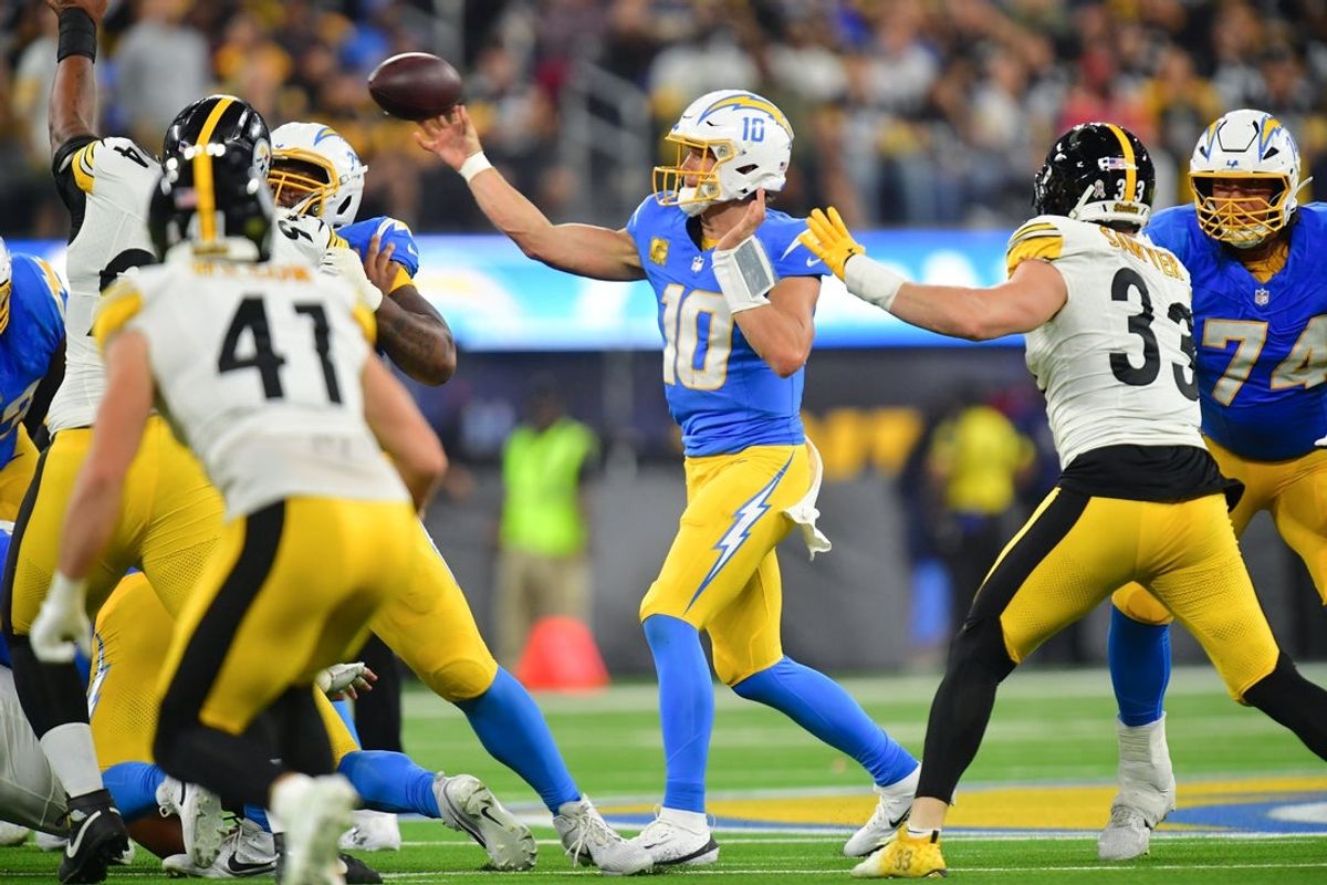 Nov 9, 2025; Inglewood, California, USA; Los Angeles Chargers quarterback Justin Herbert (10) passes the ball against the Pittsburgh Steelers during the second quarter of the game at SoFi Stadium. Mandatory Credit: Gary A. Vasquez-Imagn Images