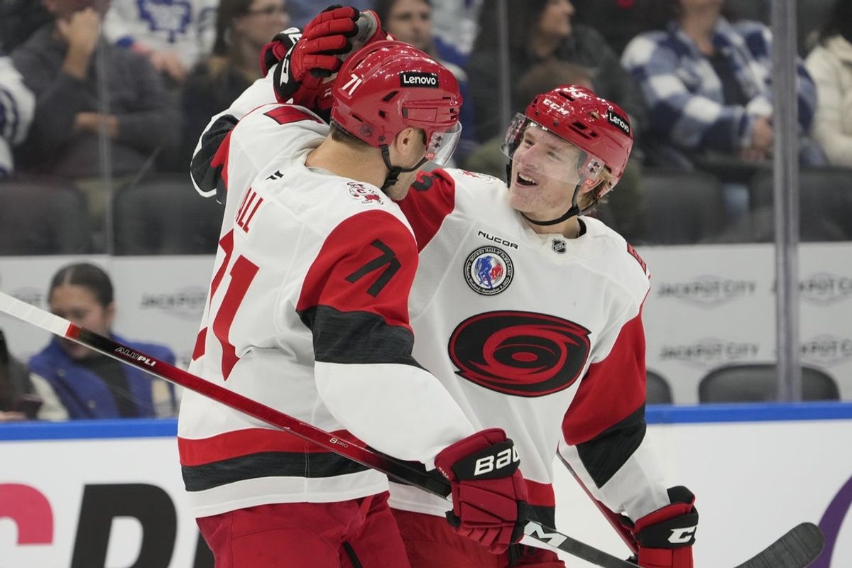 Nov 9, 2025; Toronto, Ontario, CAN; Carolina Hurricanes forward Jackson Blake (53) congratulates forward Taylor Hall (71) on his goal against the Toronto Maple Leafs during the third period at Scotiabank Arena. Mandatory Credit: John E. Sokolowski-Imagn Images