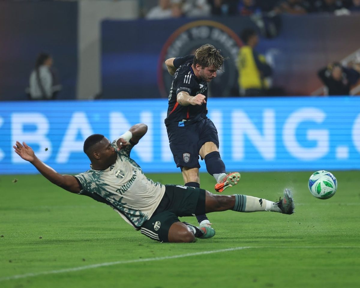 Nov 9, 2025; San Diego, California, USA; San Diego FC forward Anders Dreyer (10) kicks the ball against Portland Timbers midfielder David Da Costa (10) during the first half at Snapdragon Stadium. Mandatory Credit: Abe Arredondo-Imagn Images