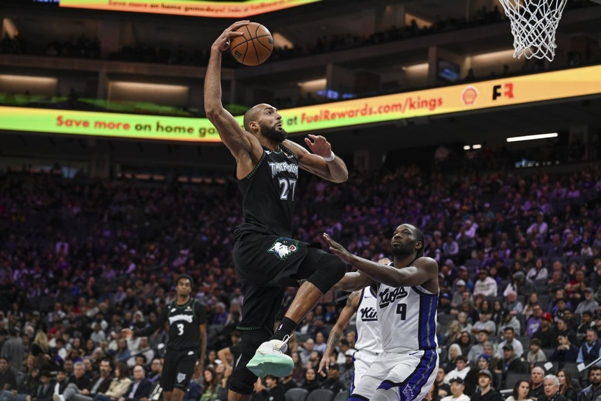 Nov 9, 2025; Sacramento, California, USA; Minnesota Timberwolves center Rudy Gobert (27) dunks the ball against Sacramento Kings forward Precious Achiuwa (9) during the fourth quarter at Golden 1 Center. Mandatory Credit: Justine Willard-Imagn Images