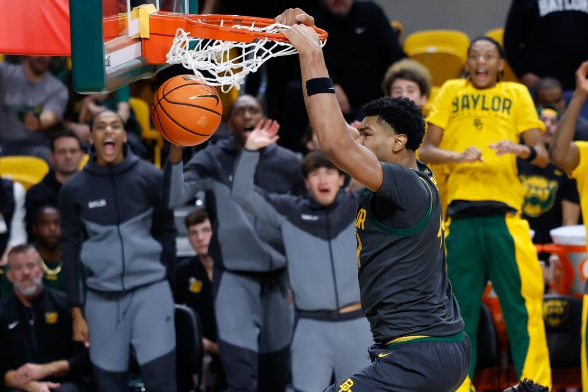 Nov 9, 2025; Waco, Texas, USA; Baylor Bears center Caden Powell (44) dunks the ball against the Washington Huskies during the second half at Paul and Alejandra Foster Pavilion. Mandatory Credit: Chris Jones-Imagn Images