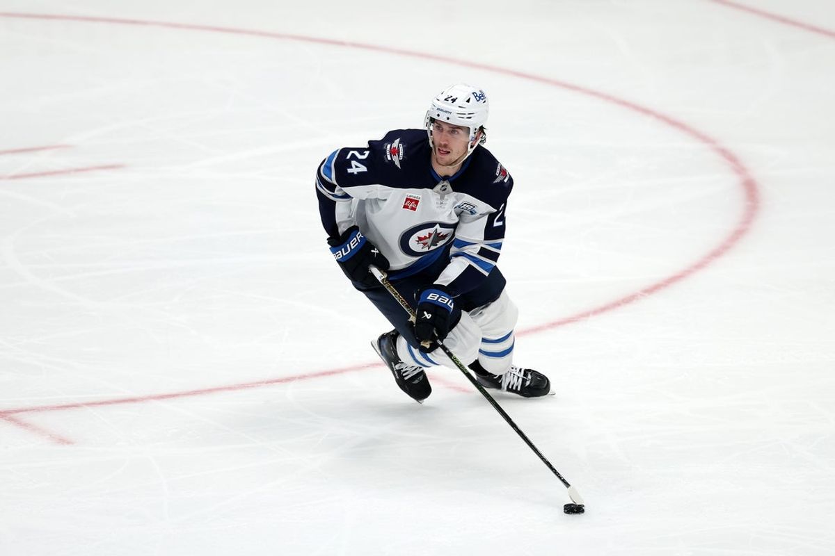 Nov 9, 2025; Anaheim, California, USA;  Winnipeg Jets defenseman Haydn Fleury (24) skates with the puck during the third period against the Anaheim Ducks at Honda Center. Mandatory Credit: Kiyoshi Mio-Imagn Images