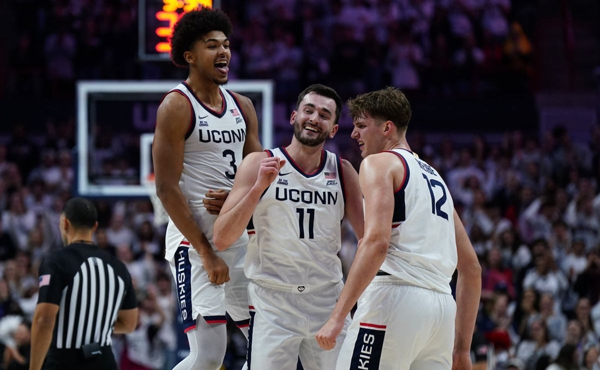 Nov 10, 2025; Storrs, Connecticut, USA; UConn Huskies forward Alex Karaban (11) reacts with teammates after his basket against the Columbia Lions in the first half at Harry A. Gampel Pavilion. Mandatory Credit: David Butler II-Imagn Images