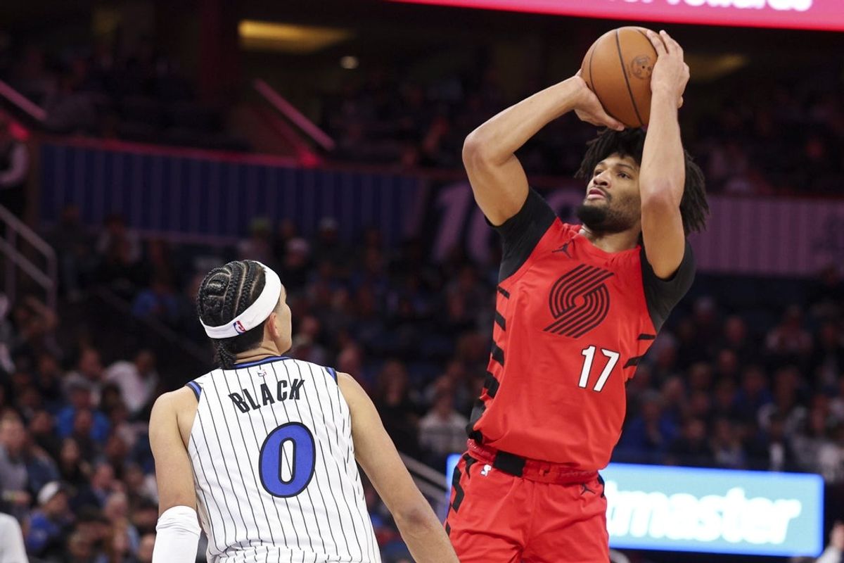 Nov 10, 2025; Orlando, Florida, USA; Portland Trail Blazers guard Shaedon Sharpe (17) shoots the ball over Orlando Magic guard Anthony Black (0) in the second quarter at Kia Center. Mandatory Credit: Nathan Ray Seebeck-Imagn Images