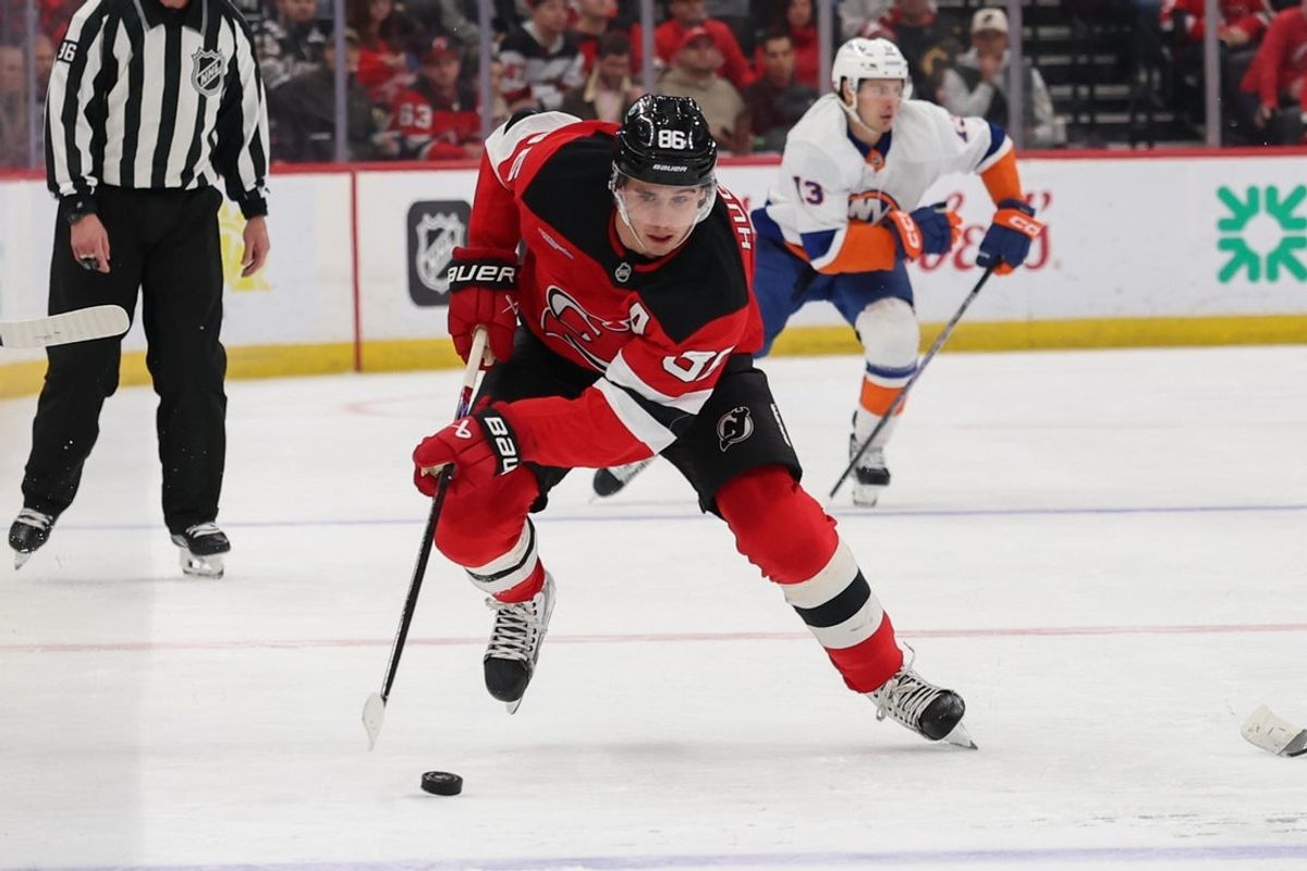 Nov 10, 2025; Newark, New Jersey, USA; New Jersey Devils center Jack Hughes (86) skates with the puck against the New York Islanders during the second period at Prudential Center. Mandatory Credit: Ed Mulholland-Imagn Images