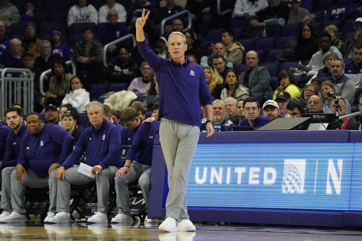 Nov 10, 2025; Evanston, Illinois, USA; Northwestern Wildcats head coach Chris Collins gestures to his team against the Cleveland State Vikings  during the first half at Welsh-Ryan Arena. Mandatory Credit: David Banks-Imagn Images