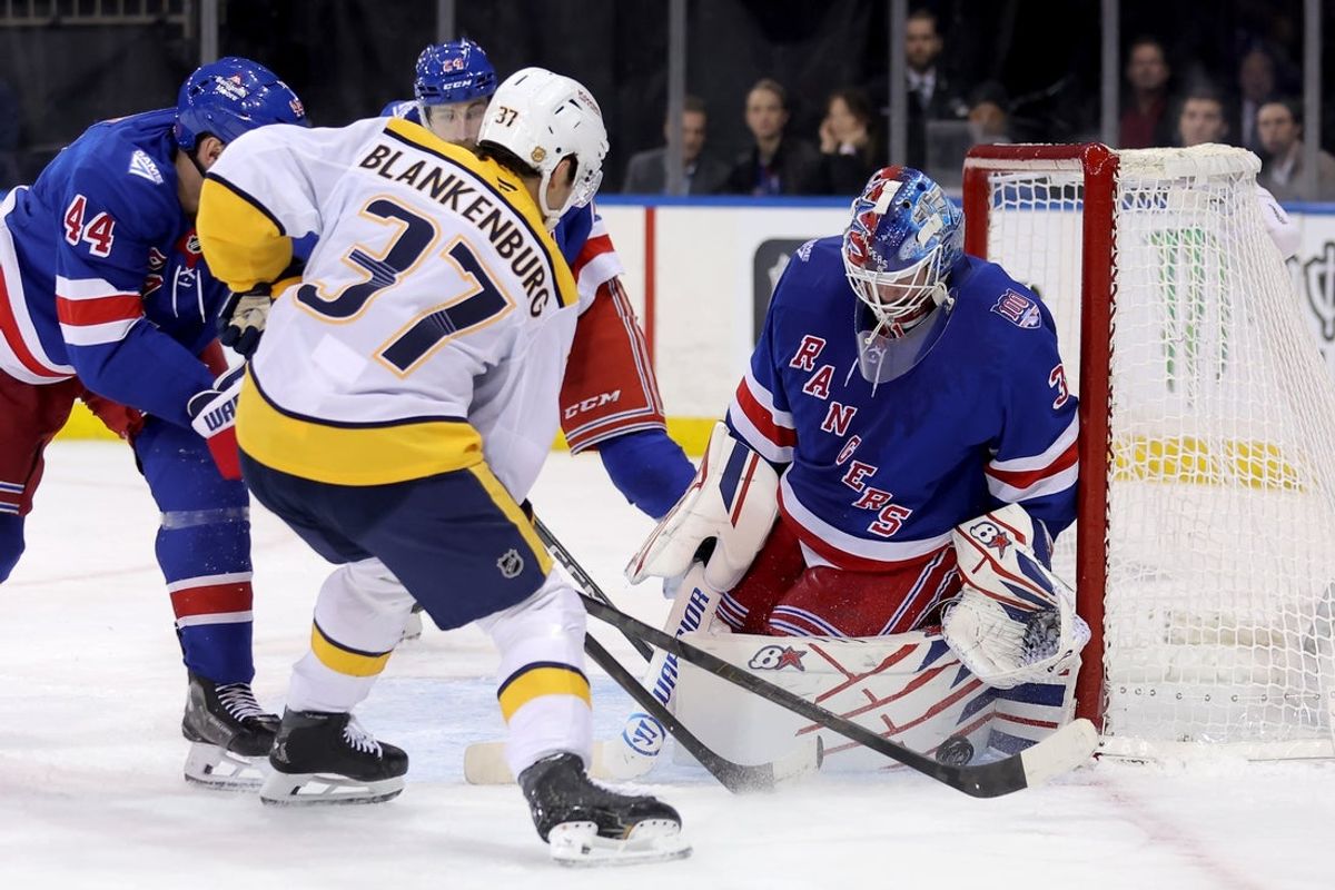 Nov 10, 2025; New York, New York, USA; New York Rangers goaltender Igor Shesterkin (31) makes a save against Nashville Predators defenseman Nick Blankenburg (37) during the third period at Madison Square Garden. Mandatory Credit: Brad Penner-Imagn Images