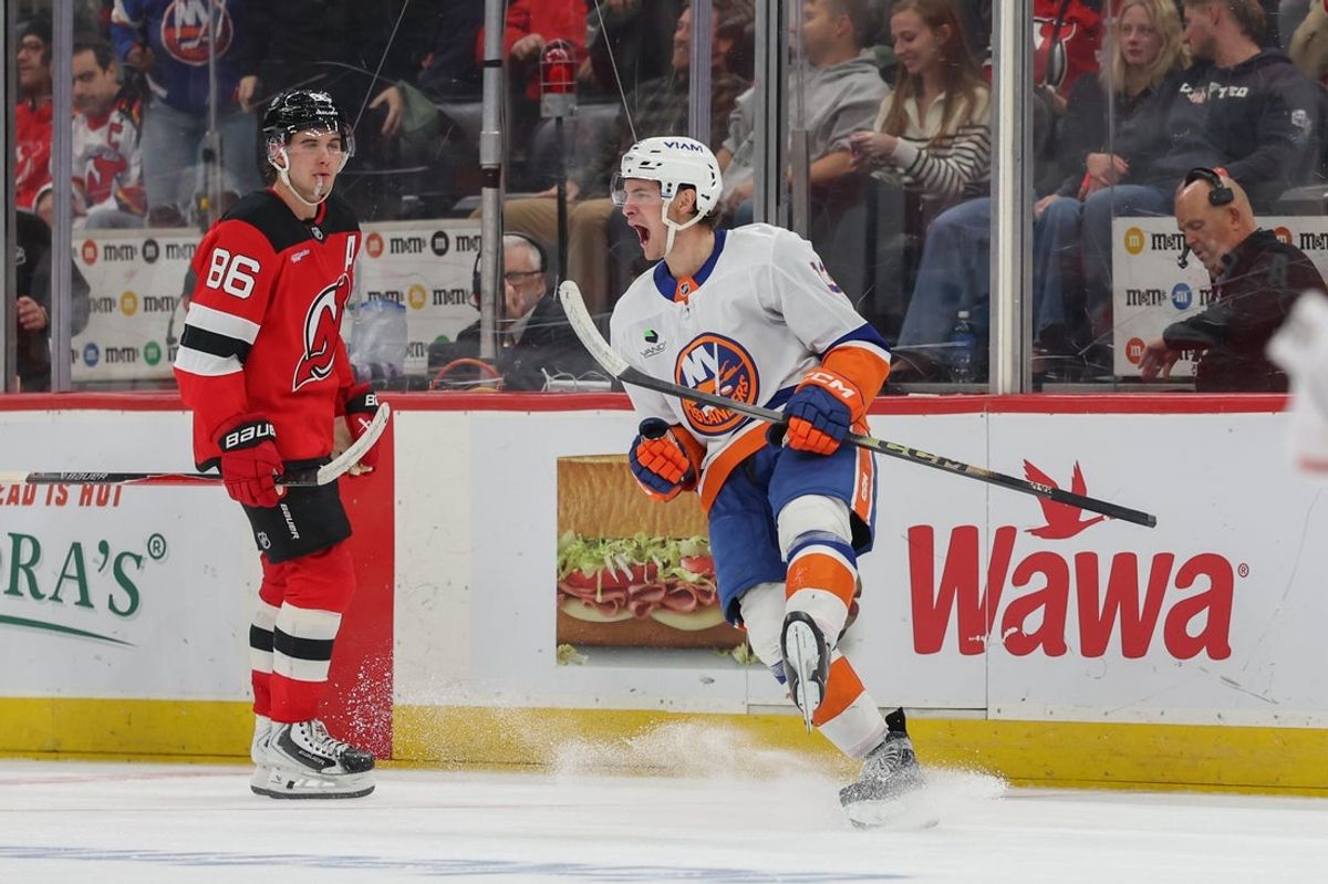 Nov 10, 2025; Newark, New Jersey, USA; New York Islanders center Mathew Barzal (13) celebrates his game winning goal against the New Jersey Devils during overtime at Prudential Center. Mandatory Credit: Ed Mulholland-Imagn Images