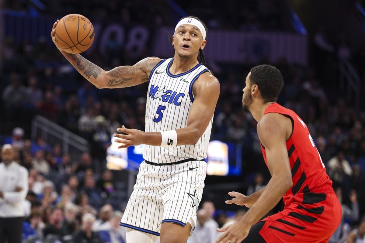 Nov 10, 2025; Orlando, Florida, USA; Orlando Magic forward Paolo Banchero (5) passes the ball against the Portland Trail Blazers in the third quarter at Kia Center. Mandatory Credit: Nathan Ray Seebeck-Imagn Images