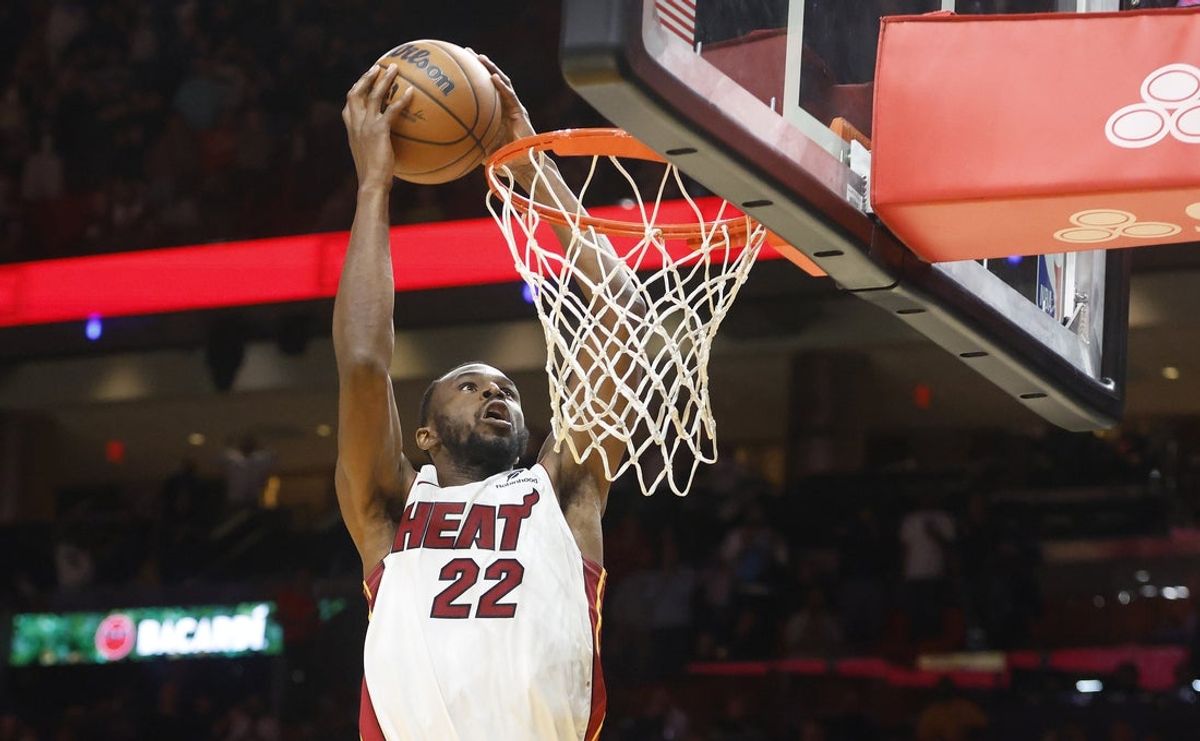 Nov 10, 2025; Miami, Florida, USA;  Miami Heat forward Andrew Wiggins (22) dunks against the Cleveland Cavaliers during overtime at Kaseya Center. Mandatory Credit: Rhona Wise-Imagn Images