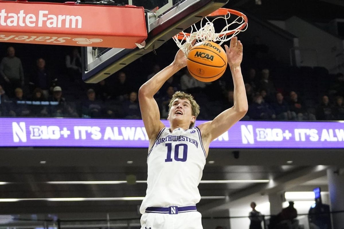 Nov 10, 2025; Evanston, Illinois, USA; Northwestern Wildcats guard Max Green (10) dunks the ball against the Cleveland State Vikings during the second half at Welsh-Ryan Arena. Mandatory Credit: David Banks-Imagn Images