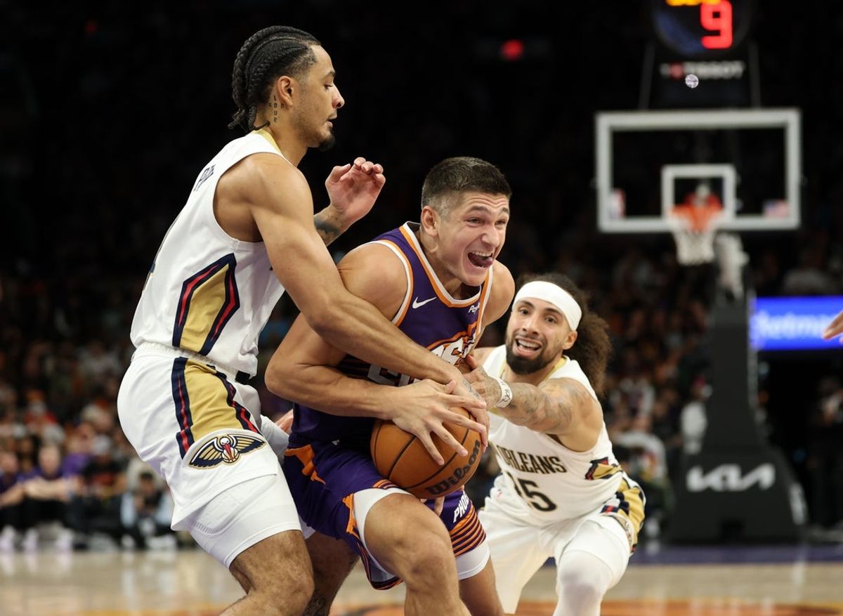Nov 10, 2025; Phoenix, Arizona, USA; Phoenix Suns guard Grayson Allen (8) drives to the basket against New Orleans Pelicans guard Micah Peavy in the second half at the Mortgage Matchup Center. Mandatory Credit: Mark J. Rebilas-Imagn Images