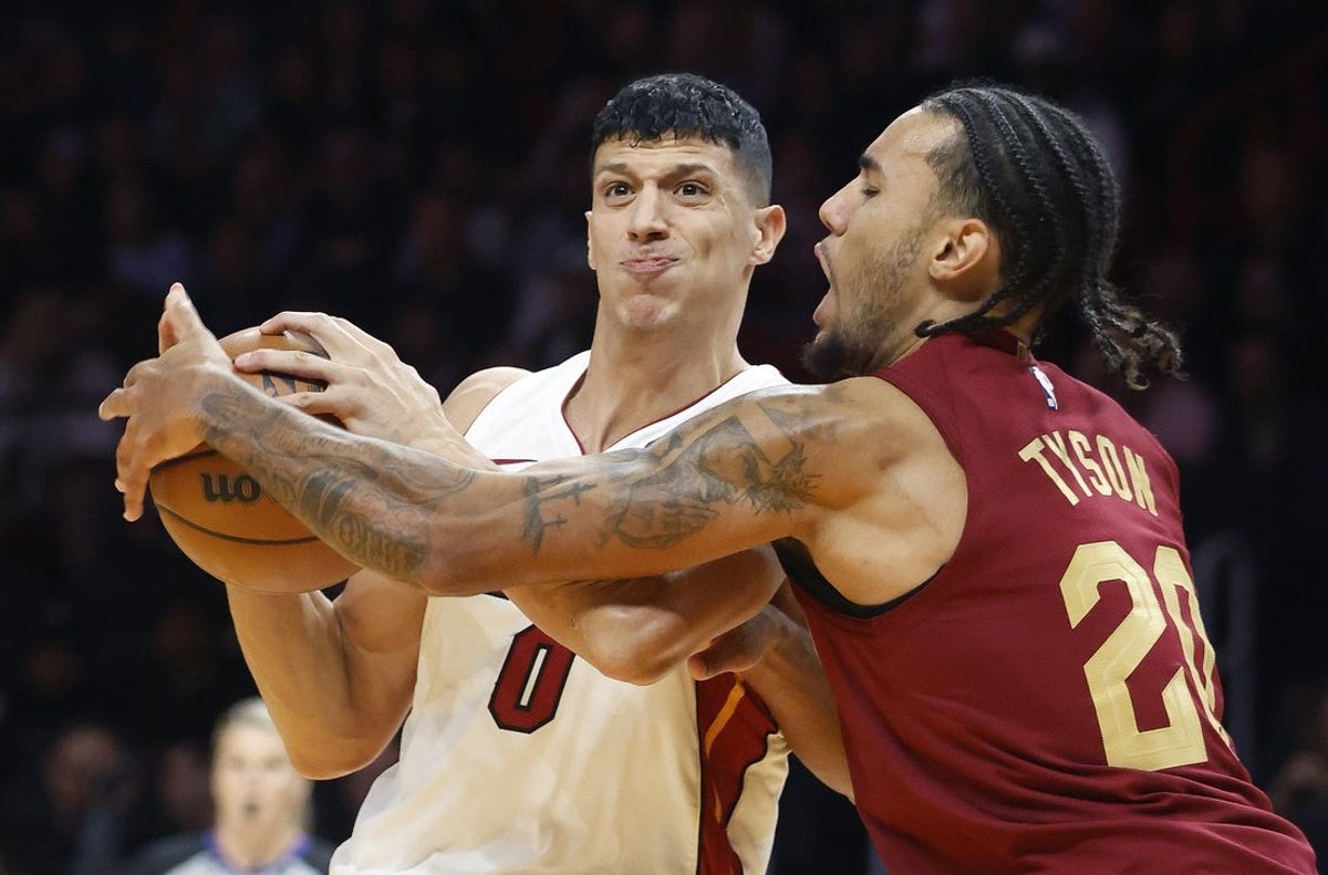Nov 10, 2025; Miami, Florida, USA;  Cleveland Cavaliers guard Jaylon Tyson (20) defends Miami Heat forward Simone Fontecchio (0) during the second half at Kaseya Center. Mandatory Credit: Rhona Wise-Imagn Images