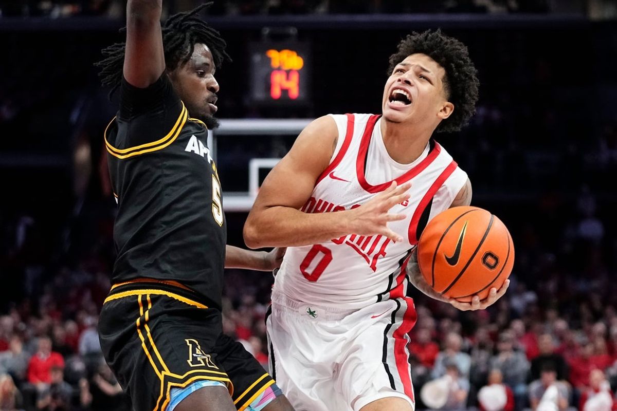 Ohio State Buckeyes guard John Mobley Jr. (0) drives past Appalachian State Mountaineers guard Jason Clarke Jr. (5) during the NCAA men's basketball game at Value City Arena in Columbus on Nov. 11, 2025.