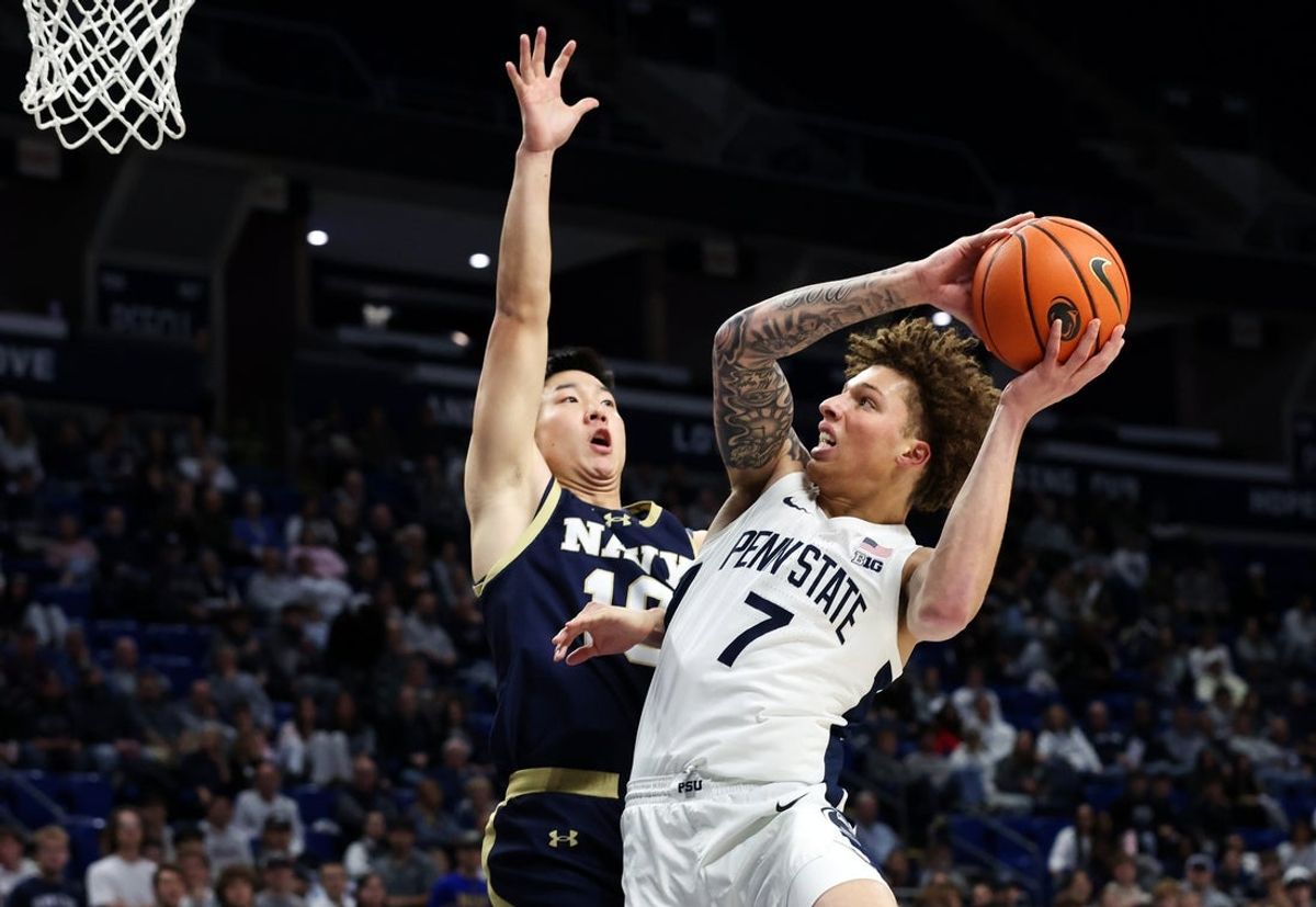 Nov 11, 2025; University Park, Pennsylvania, USA; Penn State Nittany Lions guard Dominick Stewart (7) attempts to shoot the ball defended by Navy Midshipmen guard Jinwoo Kim (10) during the first half at Bryce Jordan Center. Mandatory Credit: Matthew O'Haren-Imagn Images