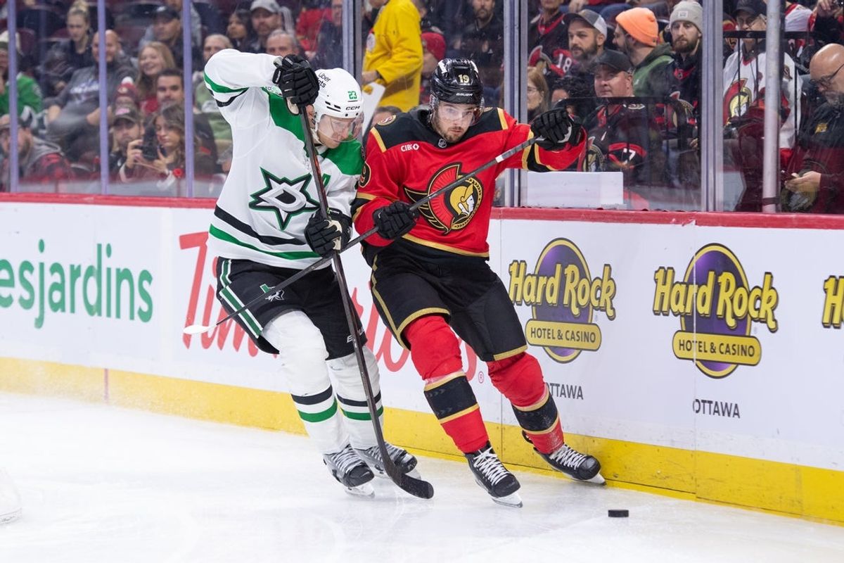 Nov 11, 2025; Ottawa, Ontario, CAN; Dallas Stars defenseman Esa Lindell (23) battles for control of the puck with  Ottawa Senators right wing Drake Batherson (19)  in the first period at the Canadian Tire Centre. Mandatory Credit: Marc DesRosiers-IMAGN Images