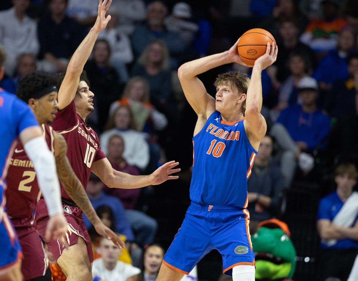 Florida forward Thomas Haugh (10) rebounds against Florida State guard Lajae Jones (10) during the first half of an NCAA mens basketball game at Exactec Areana at the Steven C. O Connell Center in Gainesville, FL on Tuesday, November 11, 2025. [Alan Youngblood/Gainesville Sun]