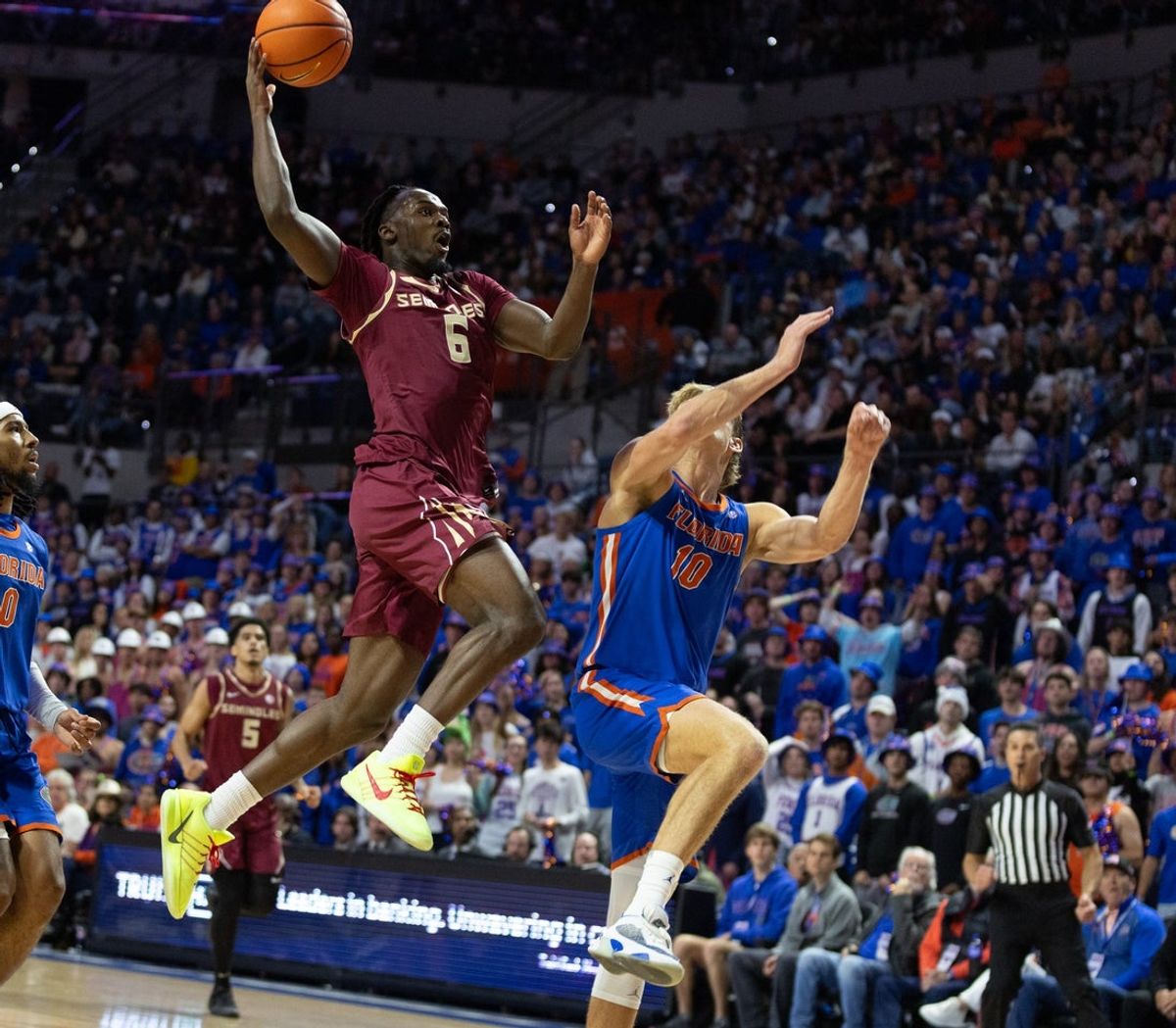 Florida State guard Robert McCray V (6) shoots past Florida forward Thomas Haugh (10) during the first half of an NCAA mens basketball game at Exactec Areana at the Steven C. O Connell Center in Gainesville, FL on Tuesday, November 11, 2025. [Alan Youngblood/Gainesville Sun]