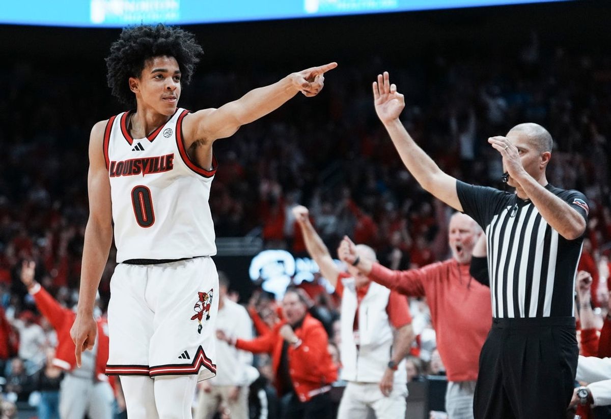 Louisville Cardinals guard Mikel Brown Jr. (0) celebrates his three-point shot as the Cards go up over Kentucky in the first half during the UofL-UK annual rivalry game at the KFC Yum! Center in Louisville, Kentucky Nov. 11, 2025.