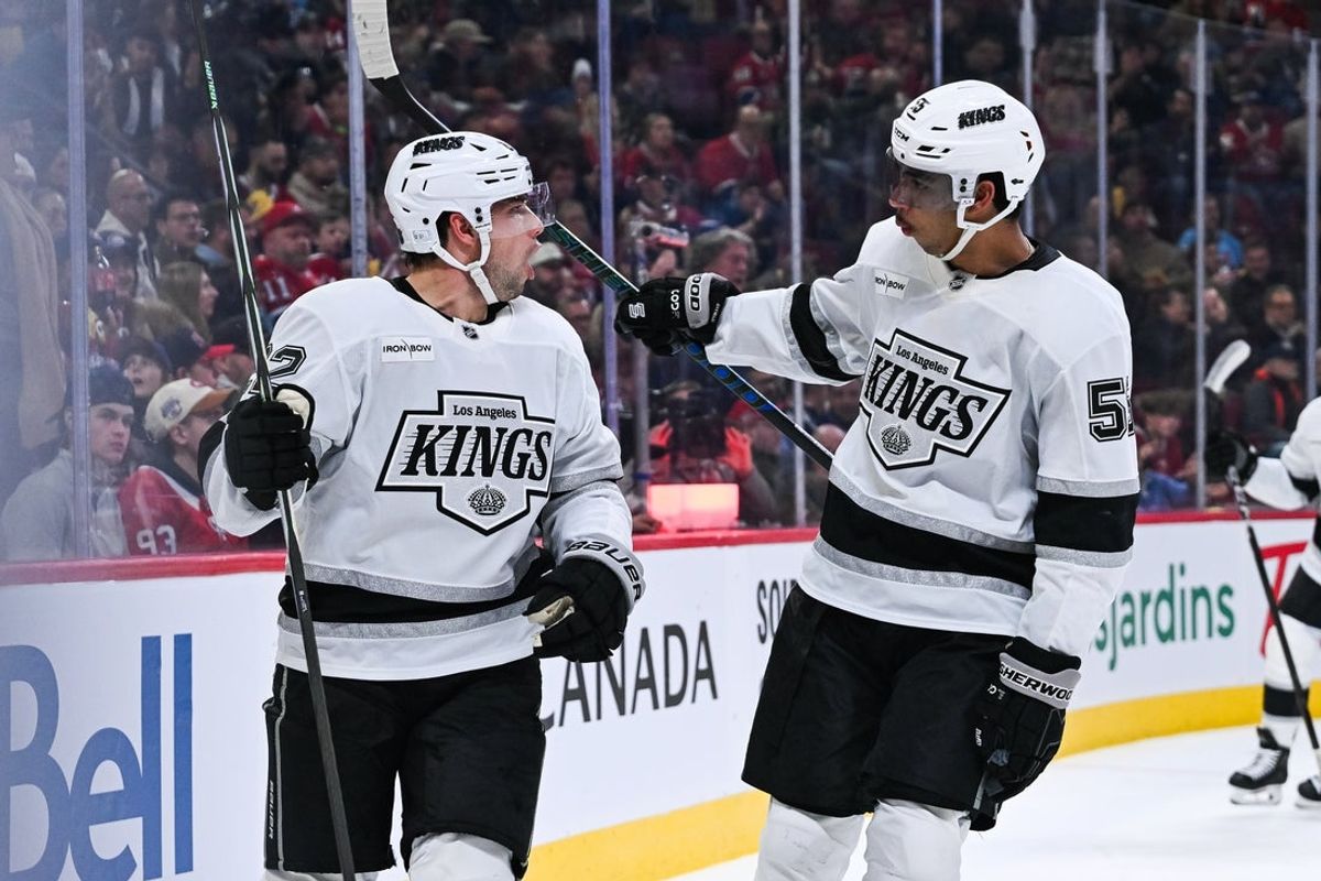 Nov 11, 2025; Montreal, Quebec, CAN; Los Angeles Kings left wing Kevin Fiala (22) celebrates with right wing Quinton Byfield (55) his goal against the Montreal Canadiens during the second period at Bell Centre. Mandatory Credit: David Kirouac-Imagn Images