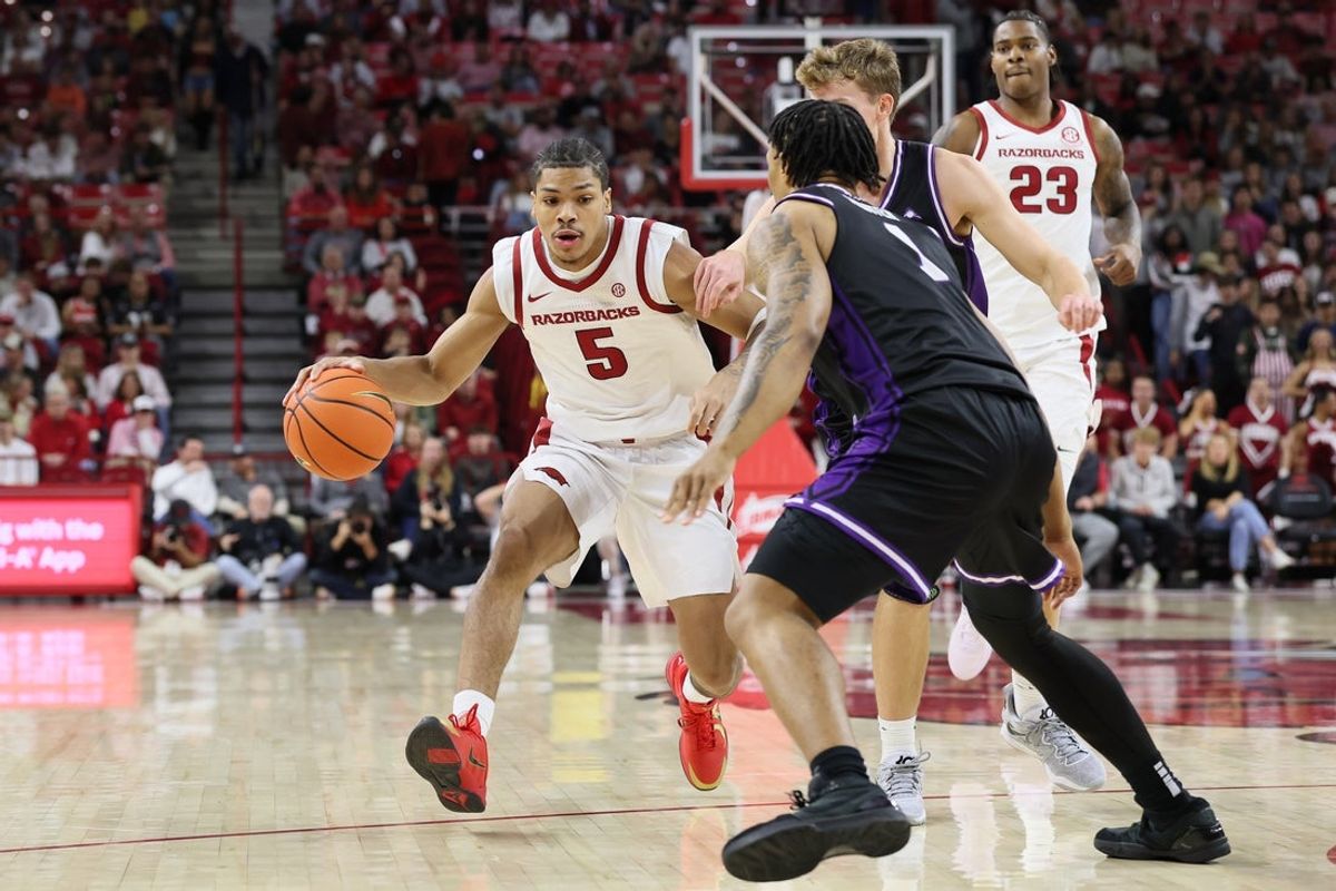 Nov 11, 2025; Fayetteville, Arkansas, USA; Arkansas Razorbacks guard Darius Acuff Jr (5) drives during the first half against the UCA Bears at Bud Walton Arena. Mandatory Credit: Nelson Chenault-Imagn Images