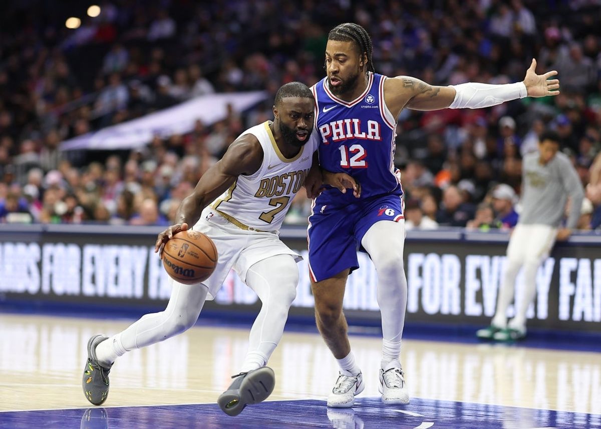Nov 11, 2025; Philadelphia, Pennsylvania, USA; Boston Celtics guard Jaylen Brown (7) drives against Philadelphia 76ers forward Trendon Watford (12) during the second quarter at Xfinity Mobile Arena. Mandatory Credit: Bill Streicher-Imagn Images