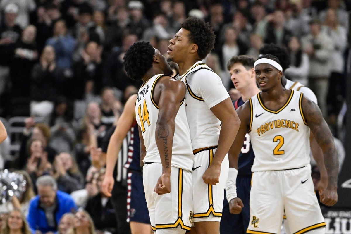 Nov 11, 2025; Providence, Rhode Island, USA; Providence Friars guard Jaylen Harrell (4) chest bumps guard Jr. Corey Floyd (14) during the second half against the Penn Quakers at Amica Mutual Pavilion. Mandatory Credit: Eric Canha-Imagn Images