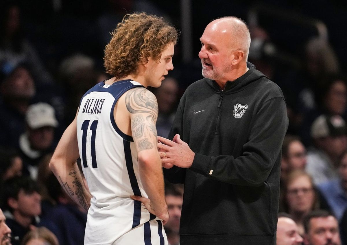 Butler Bulldogs guard Finley Bizjack (11) talks with Butler Bulldogs head coach Thad Matta on Tuesday, Nov. 11, 2025, during the game at Hinkle Fieldhouse in Indianapolis. The Butler Bulldogs defeated the Chicago State Cougars, 98-66.