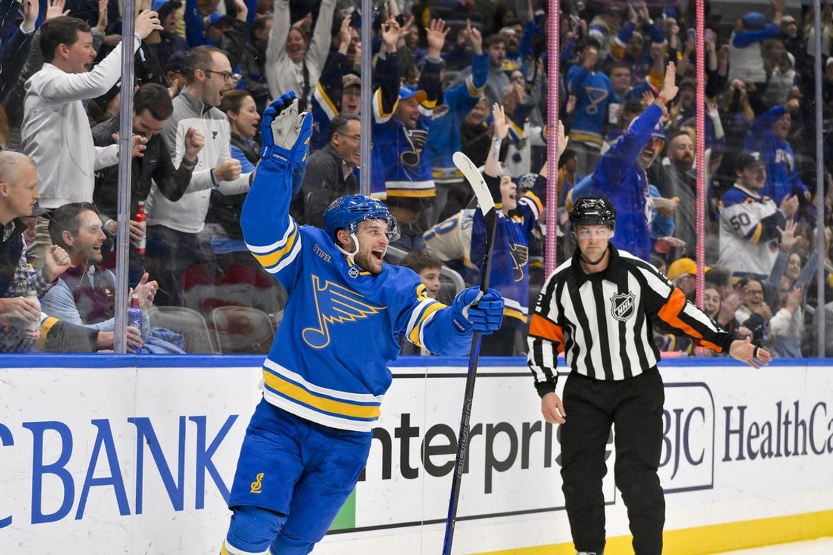 Nov 11, 2025; St. Louis, Missouri, USA; St. Louis Blues left wing Nathan Walker (26) reacts after scoring against the Calgary Flames during the second period at Enterprise Center. Mandatory Credit: Jeff Curry-Imagn Images